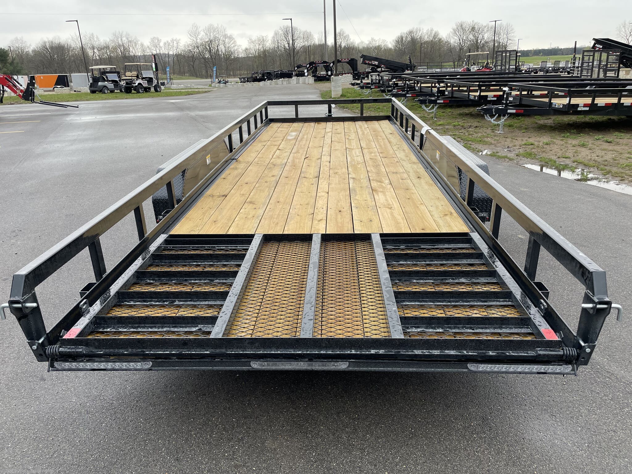H&H 82" x 22' Heavy Duty Landscape/Utility Trailer, 5" x 3" x 1/4" Steel Angle Frame, 3" x 2" x 3/16" Steel Angle Crossmembers, 5" Steel Channel Tongue, Fully Wrapped, 3" x 2" Steel Tube Top Rail, 2-5/16" A-Frame Posi-Lock Coupler, Dual Safety Chains and Hooks, 7-Way RV-Style Plug, Enclosed Sealed Wiring Harness, 7k Rated Setback Drop Leg Jack, 50" Tall Reinforced Spring Assist Gate, Ladder Style Gate, Steel Formed Tread Plate Fenders, Tandem Spring Brake Suspension, 9900 lb GVWR, Easy Lube Hubs, ST225/75R15 'D' Tires, 15" Black Steel Wheels, Industrial Grade Polymer Finish, 2 x 8 Pressure Treated Pine Decking, Welded Front Board Retainer, Rear End Board Cap, Stake Pockets, Spare Tire Mount, Full LED DOT Compliant Lighting, Heavy Duty Utility Trailer, Landscape Trailer, Steel Angle Frame Trailer, Heavy Duty Trailer, Landscape Utility Trailer, Tandem Axle Utility Trailer, Spring Assist Gate Trailer, Steel Channel Tongue Trailer, Pressure Treated Pine Deck Trailer, Black Steel Wheels Tra
