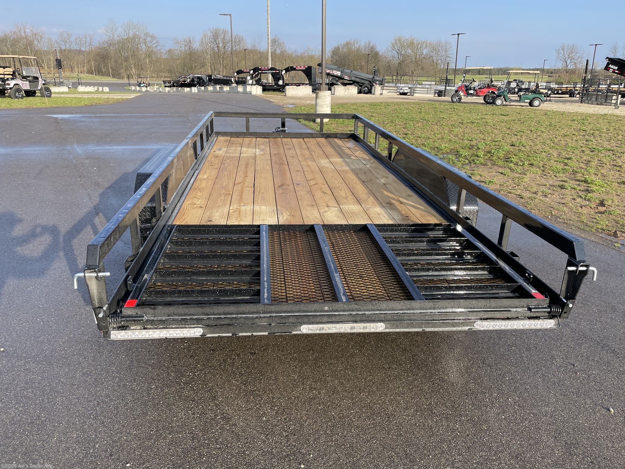 H&H 82" x 18' Heavy Duty Landscape/Utility Trailer, 5" x 3" x 1/4" Steel Angle Frame, 3" x 2" x 3/16" Steel Angle Crossmembers, 5" Steel Channel Tongue, Fully Wrapped, 3" x 2" Steel Tube Top Rail, 2-5/16" A-Frame Posi-Lock Coupler, Dual Safety Chains and Hooks, 7-Way RV-Style Plug, Enclosed Sealed Wiring Harness, 7k Rated Setback Drop Leg Jack, 50" Tall Reinforced Spring Assist Gate, Ladder Style Gate, Steel Formed Tread Plate Fenders, Tandem Spring Brake Suspension, 9900 lb GVWR, Easy Lube Hubs, ST225/75R15 'D' Tires, 15" Black Steel Wheels, Industrial Grade Polymer Finish, 2 x 8 Pressure Treated Pine Decking, Welded Front Board Retainer, Rear End Board Cap, Stake Pockets, Spare Tire Mount, Full LED DOT Compliant Lighting, Heavy Duty Landscape Trailer, Utility Trailer with Steel Frame, Steel Angle Crossmembers Trailer, Heavy Duty Trailer with Spring Assist Gate, Tandem Brake Suspension Trailer, Pressure Treated Pine Deck Utility Trailer, Steel Tube Top Rail Trailer, DOT Compliant Trai