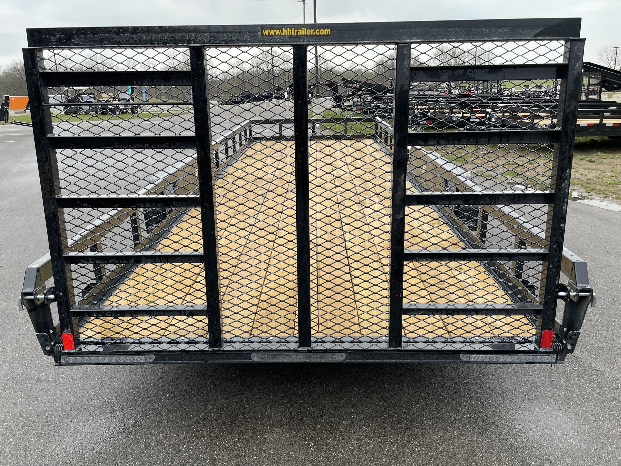 H&H 82" x 22' Heavy Duty Landscape/Utility Trailer, 5" x 3" x 1/4" Steel Angle Frame, 3" x 2" x 3/16" Steel Angle Crossmembers, 5" Steel Channel Tongue, Fully Wrapped, 3" x 2" Steel Tube Top Rail, 2-5/16" A-Frame Posi-Lock Coupler, Dual Safety Chains and Hooks, 7-Way RV-Style Plug, Enclosed Sealed Wiring Harness, 7k Rated Setback Drop Leg Jack, 50" Tall Reinforced Spring Assist Gate, Ladder Style Gate, Steel Formed Tread Plate Fenders, Tandem Spring Brake Suspension, 9900 lb GVWR, Easy Lube Hubs, ST225/75R15 'D' Tires, 15" Black Steel Wheels, Industrial Grade Polymer Finish, 2 x 8 Pressure Treated Pine Decking, Welded Front Board Retainer, Rear End Board Cap, Stake Pockets, Spare Tire Mount, Full LED DOT Compliant Lighting, Heavy Duty Utility Trailer, Landscape Trailer, Steel Angle Frame Trailer, Heavy Duty Trailer, Landscape Utility Trailer, Tandem Axle Utility Trailer, Spring Assist Gate Trailer, Steel Channel Tongue Trailer, Pressure Treated Pine Deck Trailer, Black Steel Wheels Tra