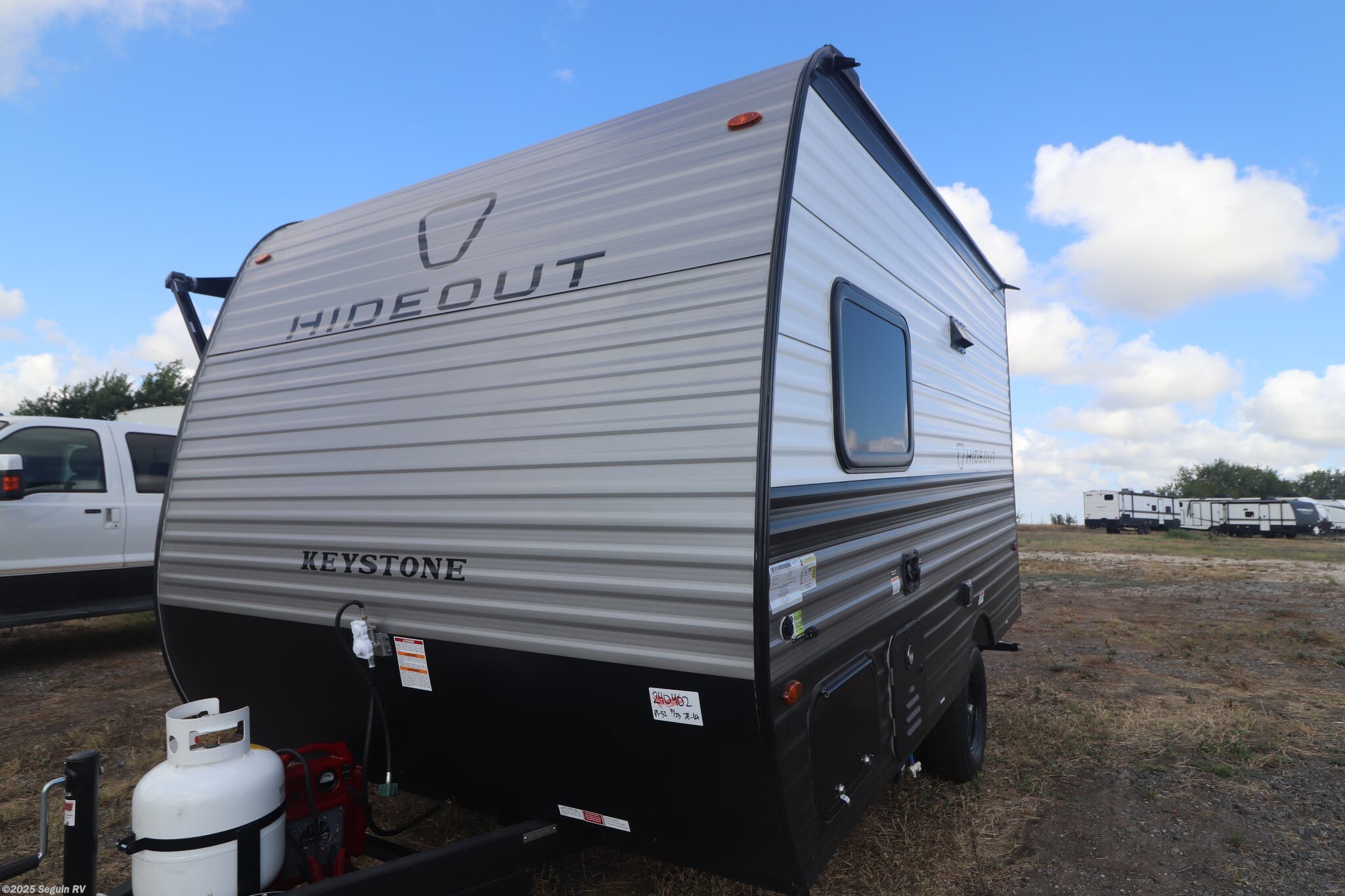 Email now about this 2026 Keystone Hideout 130BH! New 2026 Keystone Hideout 130BH available in Seguin, Texas