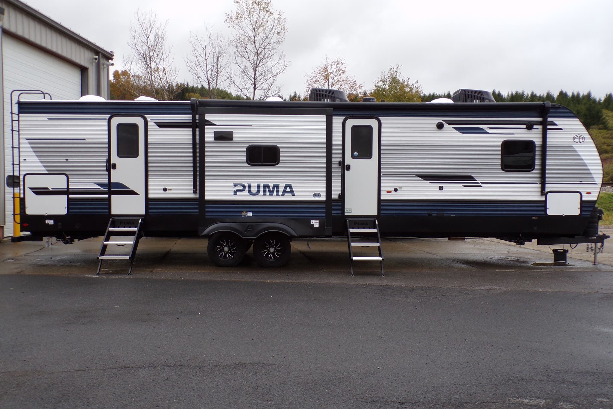 Call now about this 2026 Palomino Puma 32BH2B! 2026 Palomino Puma 32BH2B - New Travel Trailer For Sale by Hometown RV LLC in Brockway, Pennsylvania features Spare Tire Kit, Leveling Jacks, Shower, Black Tank Flush, Detachable Power Cord