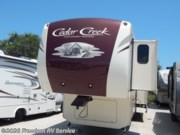 Call now about this 2017 Forest River Cedar Creek 36CK2! 2017 Forest River Cedar Creek 36CK2 - Used Fifth Wheel For Sale by Freedom RV Service in Aransas Pass, Texas features Ladder, Leveling Jacks, Power Roof Vent, Free Standing Dinette w/Chairs, Exterior Speakers