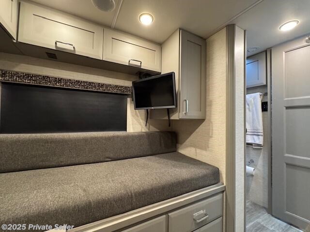 Twin bed, wardrobe, cabinets, TV