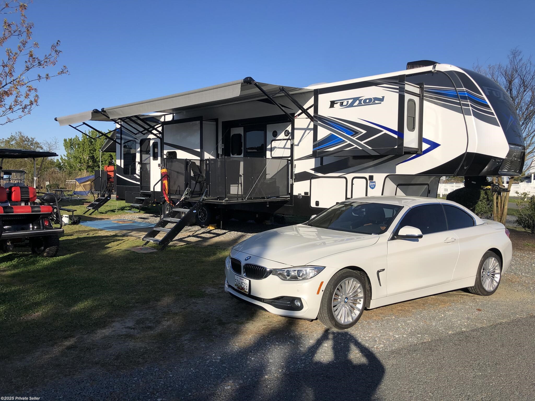 Call now about this 2021 Keystone Fuzion 424! 2021 Keystone Fuzion 424 - Used Toy Hauler For Sale by For Sale By Owner in Stevensville, Maryland features Convection Microwave, Stove, Furnace, Electric Heat, Residential Refrigerator