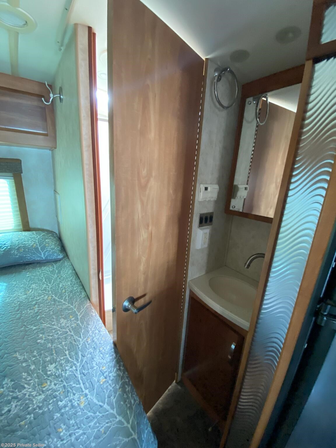 Bed, Bathroom Door and Vanity