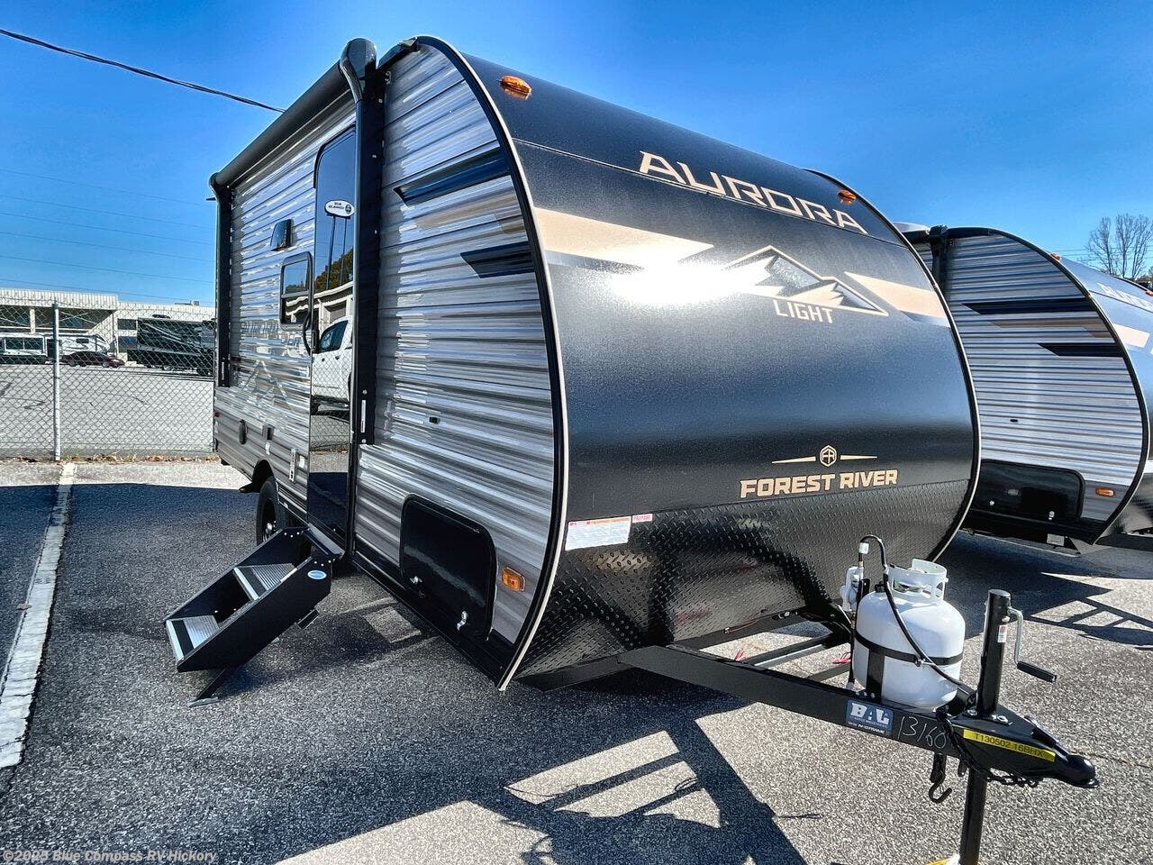 Contact us now about this 2026 Forest River Aurora Light 16BHX! 2026 Aurora Light 16BHX by Forest River from Blue Compass RV Hickory in Claremont, North Carolina