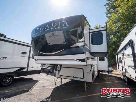 Camping trips can be spent in luxury with this fifth wheel in tow! There are four slide outs providing you with tons of interior space, and the middle bedroom will be perfect for guests. There is a sleeper sofa slide here, a desk top, and a wardrobe for their things. You will have the front private bedroom all to yourselves with a California king bed slide out, plus a walk-in closet with wrap-around shelving. There is even under bed storage and washer and dryer prep to make laundry day easier than ever. Everyone can meet in the rear kitchen and living area that includes theater seating, a free-standing dinette, and an island with a flip-up counter workstation. There is also a large hutch here and a pantry for added storage space. And we haven t even touched on the exterior; Curt entry steps, a 20  power awning, plus a Grill-N-Chill outside kitchen!  Each Arcadia 3/4 ton fifth wheel by Keystone includes a Revolutionary NGC2 Next Generation crawlspace chassis, a SpaceSaver upper deck design, and a Curt equalization suspension system for a smooth towing experience. You will find abundant storage space throughout, residential Roman shades with black-out backing, designer vinyl flooring throughout, and custom cabinetry with solid wood and painted cabinet doors. Each model includes the exclusive Blade Pure high-performance air handling system for increased A/C airflow, along with a 35K BTU high output furnace so you can camp all year long. The SolarFlex system includes a standard 200 watt solar panel, or you can choose the optional 400i or 600i-L solar power system, along with the optional Dragonfly energy lithium-ion batteries. The Arcadia is constructed with fully laminated, aluminum framed one-piece sidewalls, a high-gloss fiberglass exterior, plus a fiberglass front cap with KeyShield protection to keep your fifth wheel looking sleek for years to come