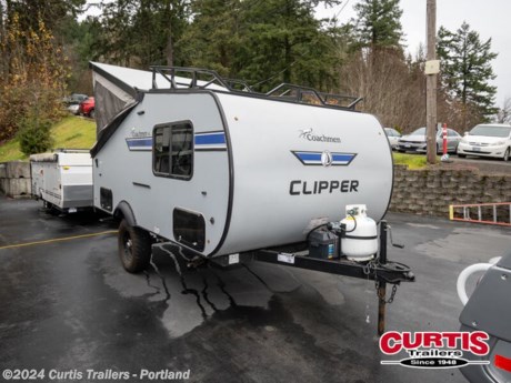 You and your spouse or buddies can take this Clipper Express Deluxe with you camping, fishing or hunting!  There is an RV queen bed up front and a gaucho offering sleeping space for three, flip lid storage, a two burner range for warm meals and a three-way refrigerator for drinks, plus a deep bowl acrylic sink to keep everything clean.  The Porta-Potti is a must have especially at night, and being able to stand up right in this pop-up is a bonus! You can even choose a few options such as the Off-Road package giving you 15 off-road tires and a spare, extended frame jacks and off-road lifted axles, and/or an exterior wall mount LP grill, a Jack It bike rack, or air conditioner   Each Clipper Camping Trailers Express hybrid folding pop-up by Coachmen is built on an E-coated tubular steel frame with a Wide Trac ultra lube spring axle, a laminated fiberglass roof, and durable, automotive grade metal exterior walls.  The inside offers Dark Ash cabinetry, 100% adhesion residential grade linoleum, and residential laminated countertops plus more depending on the Express you choose.  Enjoy the easiest way to get up and go camping with a lightweight Clipper Express that is towable by most cars, crossovers, and small SUVS.    