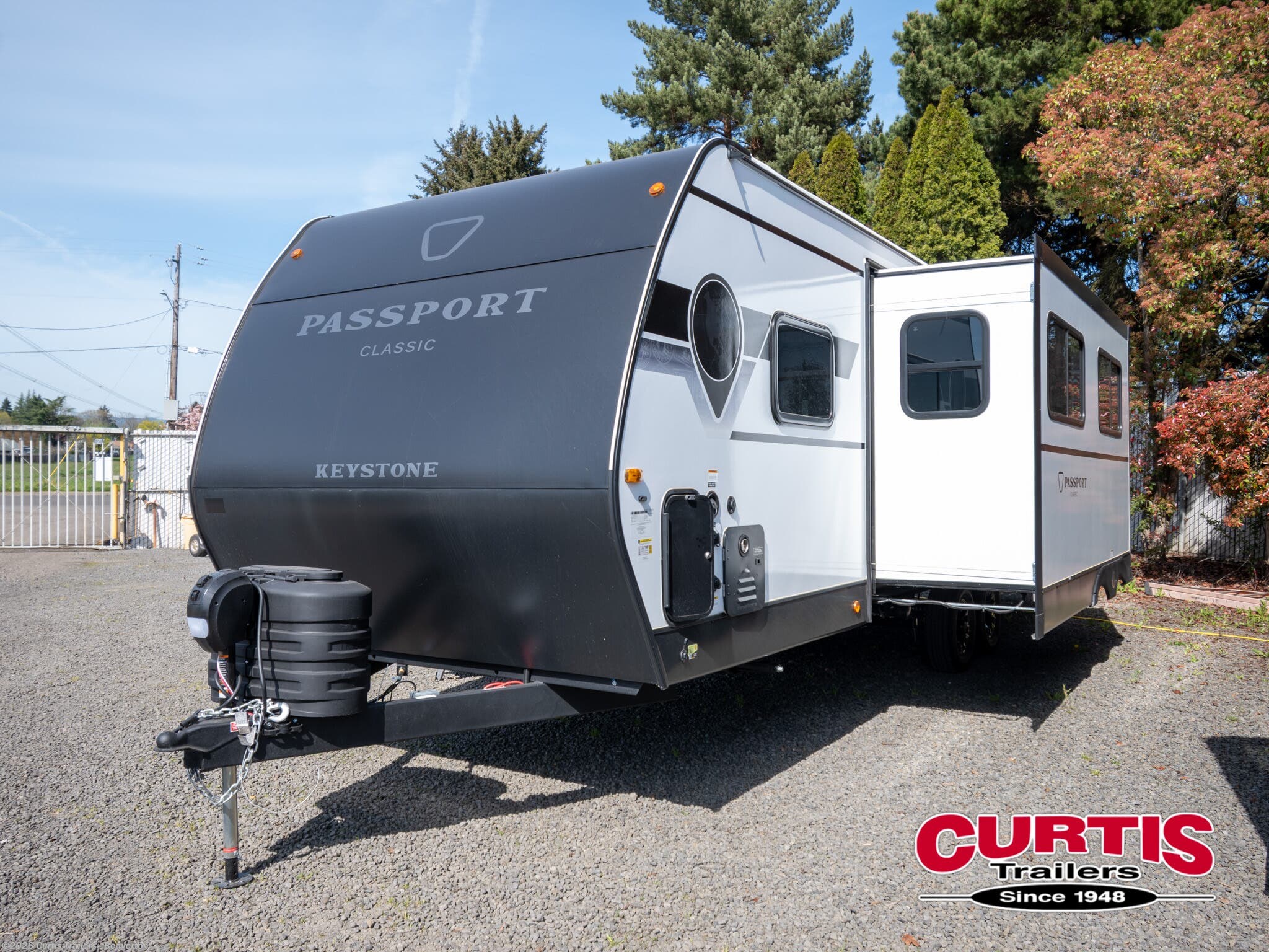 2026 Passport 284QBCWE by Keystone from Curtis Trailers - Beaverton in Beaverton, Oregon