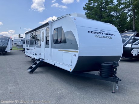 &lt;p&gt;&lt;span style=&quot;font-size: 16px;&quot;&gt;&lt;strong&gt;2025 Wildwood 29VIEW Travel Trailer...&lt;/strong&gt;&lt;/span&gt;&lt;/p&gt;
&lt;p&gt;&lt;em&gt;Rear Kitchen, Front Bedroom, Bunkhouse...&lt;/em&gt;&lt;/p&gt;
&lt;p&gt;&lt;strong&gt;Features Include:&lt;/strong&gt;&lt;/p&gt;
&lt;ul&gt;
&lt;li&gt;Platinum Fiberglass Exterior Walls&lt;/li&gt;
&lt;li&gt;Best in Class Value Package&lt;/li&gt;
&lt;li&gt;Spare Tire &amp;amp; Carrier&lt;/li&gt;
&lt;li&gt;15,000&amp;nbsp;btu&amp;nbsp;Ducted Air Conditioner&lt;/li&gt;
&lt;li&gt;13,500&amp;nbsp;btu&amp;nbsp;Bedroom Air Conditioner&lt;/li&gt;
&lt;li&gt;Washer/Dryer Prep&lt;/li&gt;
&lt;li&gt;Electric Fireplace&lt;/li&gt;
&lt;li&gt;Custom King Bed w/&amp;nbsp;Versa-Tilt Bed Lift&lt;/li&gt;
&lt;li&gt;11 cf 12v/DC Refrigerator/Freezer&lt;/li&gt;
&lt;li&gt;Tankless&amp;nbsp;/ On-Demand Water Heater&lt;/li&gt;
&lt;li&gt;Skylight Over the Shower&lt;/li&gt;
&lt;li&gt;Solid Step Entry Step&lt;/li&gt;
&lt;li&gt;Modern Roller Shades w/ Auto Stop&lt;/li&gt;
&lt;li&gt;Solar Prep &amp;amp; LED Interior Lighting&lt;/li&gt;
&lt;li&gt;Power Patio Awning - 22&#39;&lt;/li&gt;
&lt;li&gt;Power Stabilizer Jacks (4)&lt;/li&gt;
&lt;li&gt;Power Tongue Jack&lt;/li&gt;
&lt;li&gt;Bluetooth&amp;nbsp;Stereo&lt;/li&gt;
&lt;li&gt;Outside Stereo Speakers (2)&lt;/li&gt;
&lt;li&gt;Cable/Satellite&amp;nbsp;TV&amp;nbsp;Hookup&lt;/li&gt;
&lt;li&gt;200w Solar Panel w/ 30 amp Controller&lt;/li&gt;
&lt;/ul&gt;
&lt;p&gt;&lt;span style=&quot;font-style: italic; font-weight: bold;&quot;&gt;Our Sale Price Includes: &amp;nbsp;Pre-Delivery Inspection, RV/Marine Battery, Propane Bottles Filled, Walk&amp;nbsp;Thru&amp;nbsp;Orientation &amp;amp; Factory Freight Charges...&lt;/span&gt;&lt;/p&gt;