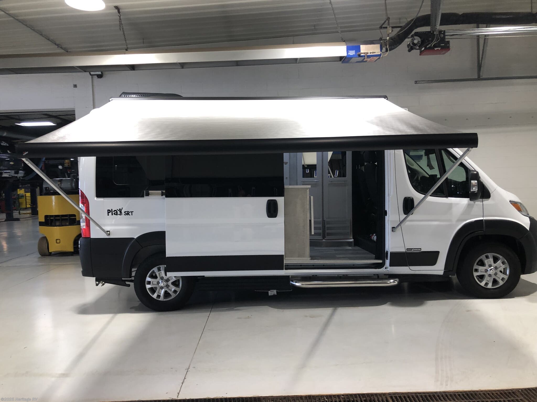 2025 Roadtrek Play SRT Rear Power Sofa - New Class B For Sale by Heritage RV in Tomahawk, Wisconsin features Fire Extinguisher, Battery Charger, Hitch, LP Detector, Water Heater