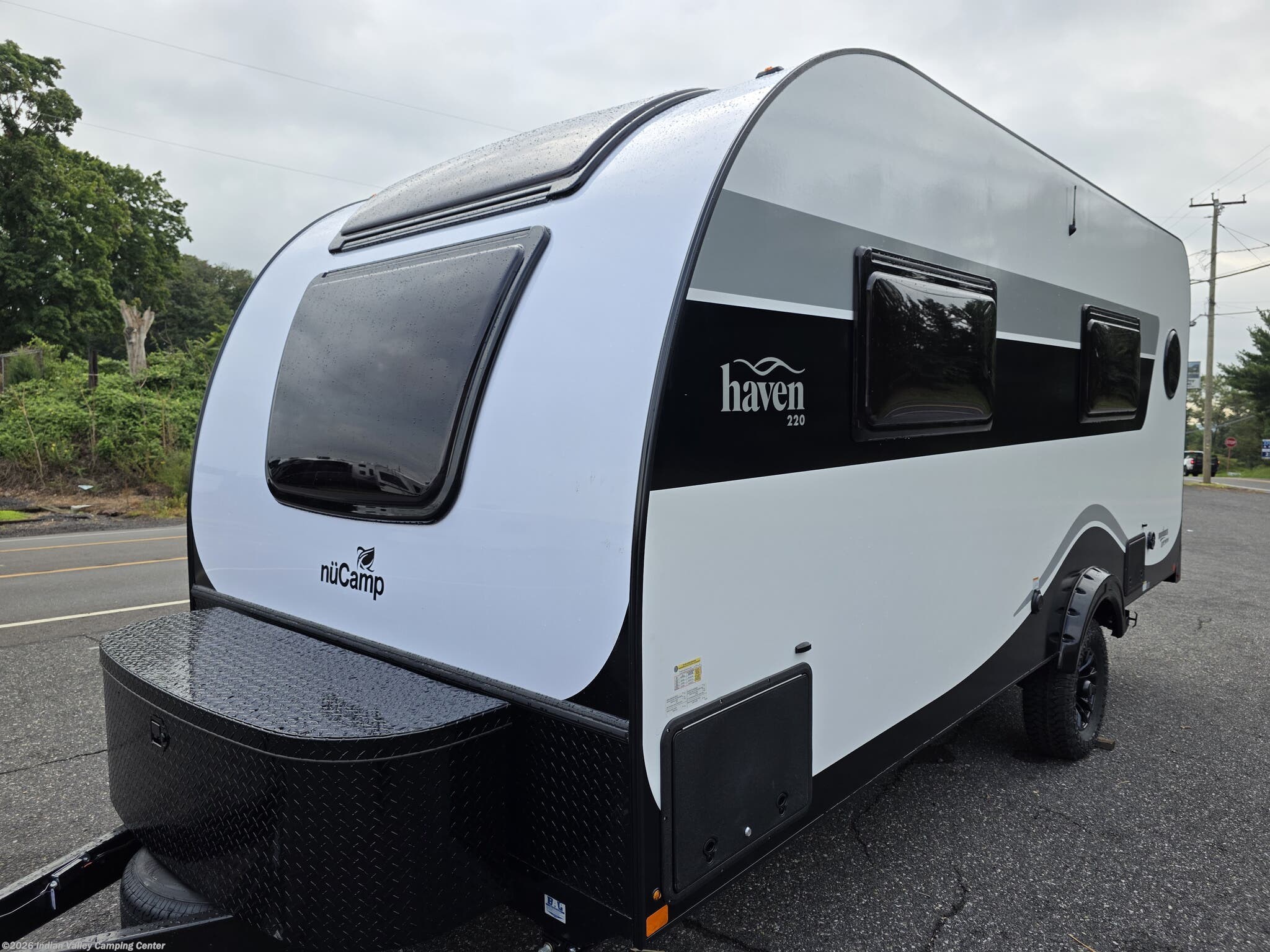 2027 NuCamp Haven Black Canyon Queen - New Travel Trailer For Sale by Indian Valley Camping Center in Souderton, Pennsylvania features Batteries, Queen Bed, Refrigerator, LP Detector, Microwave