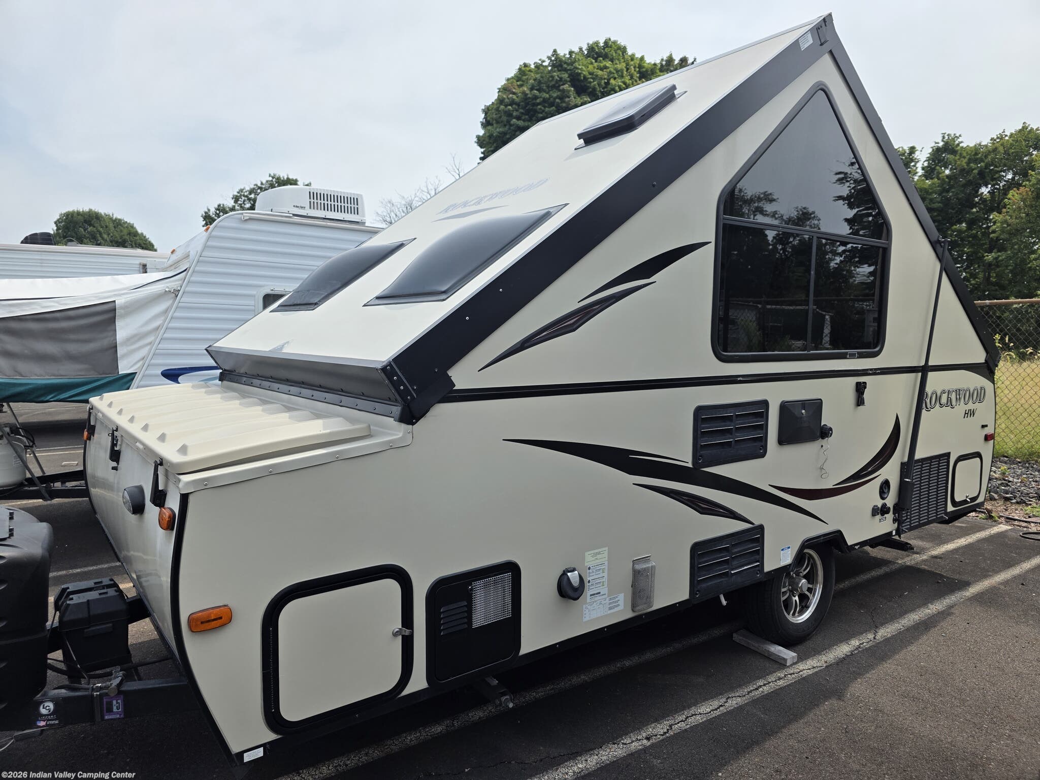 2016 Forest River Rockwood Hard Side A213HW - Used Popup For Sale by Indian Valley Camping Center in Souderton, Pennsylvania features Heat Pump, Dinette, Shower, Tinted Windows, Battery Charger