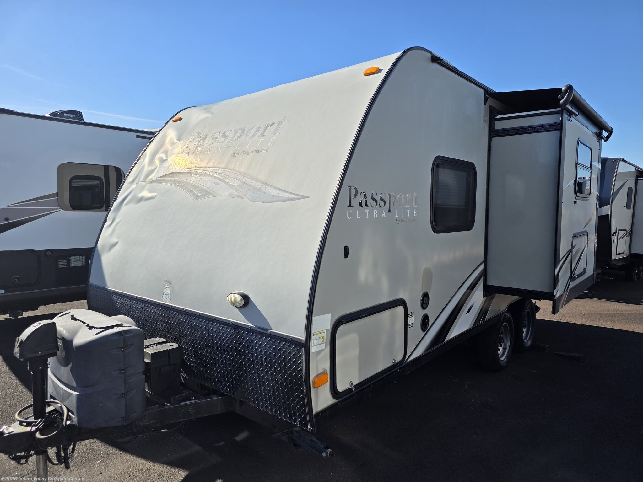 2015 Keystone Passport Express 199ML - Used Travel Trailer For Sale by Indian Valley Camping Center in Souderton, Pennsylvania features Stabilizer Jacks, Oven, Exterior Speakers, Spare Tire Kit, Propane