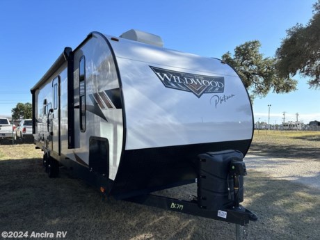 &lt;p&gt;&lt;strong&gt;Embark on Your Next Adventure with the 2023 Forest River Wildwood 26RBS&lt;/strong&gt;&lt;/p&gt;
&lt;p&gt;Experience unparalleled comfort and convenience as you explore the great outdoors with the 2023 Forest River Wildwood 26RBS. This travel trailer, perfect for adventurers who seek both wilderness and comfort, is located conveniently at &lt;a target=&quot;_new&quot;&gt;30500 Interstate 10 W, Boerne, TX 78006-9250&lt;/a&gt;, ready to be the starting point of your next journey.&lt;/p&gt;
&lt;p&gt;&lt;strong&gt;Specifications &amp;amp; Features:&lt;/strong&gt;&lt;/p&gt;
&lt;ul&gt;
&lt;li&gt;&lt;strong&gt;Spacious Design:&lt;/strong&gt; With a length of 31.08 feet, width of 8 feet, and a height of 11.25 feet, the Wildwood 26RBS promises ample space for living and storage????.&lt;/li&gt;
&lt;li&gt;&lt;strong&gt;Weight Details:&lt;/strong&gt; A dry weight of 6,721 lbs and a payload capacity of 3,002 lbs ensure that you can carry all your essentials without worry????.&lt;/li&gt;
&lt;li&gt;&lt;strong&gt;Capacity for Comfort:&lt;/strong&gt; It comes with a fresh water tank capacity of 40 gallons, alongside gray and black water tanks each holding 30 gallons, supporting extended stays in nature????.&lt;/li&gt;
&lt;li&gt;&lt;strong&gt;Construction Excellence:&lt;/strong&gt; Featuring a wood body and aluminum sidewall construction, it combines durability with a sleek design????.&lt;/li&gt;
&lt;li&gt;&lt;strong&gt;Interior Amenities:&lt;/strong&gt; The trailer features a cozy carpet/vinyl floored kitchen and living area, centered around a U-shaped dinette, perfect for family meals or entertaining??. A full-size refrigerator and a 3-burner stove complete the kitchen, ensuring home-cooked meals are never far away??.&lt;/li&gt;
&lt;li&gt;&lt;strong&gt;Outdoor Living:&lt;/strong&gt; Enjoy the outdoors with a power retractable awning extending over 20 feet, providing shade and space for outdoor relaxation????.&lt;/li&gt;
&lt;li&gt;&lt;strong&gt;Sleeping Accommodations:&lt;/strong&gt; Comfortably sleeps up to 6 with a queen-sized bed in the master bedroom and two convertible sofa beds, making it ideal for families or groups??.&lt;/li&gt;
&lt;/ul&gt;
&lt;p&gt;&lt;strong&gt;Explore Financing &amp;amp; Trade-In Options:&lt;/strong&gt; To make ownership easier, &lt;a href=&quot;https://chat.openai.com/g/g-uPmS987Kd-ancira-rv-assistant/c/c8cf1a64-f70e-4e3b-85c8-d5640a45aff9&quot; target=&quot;_new&quot;&gt;click here to apply for credit&lt;/a&gt; or &lt;a href=&quot;https://chat.openai.com/g/g-uPmS987Kd-ancira-rv-assistant/c/c8cf1a64-f70e-4e3b-85c8-d5640a45aff9&quot; target=&quot;_new&quot;&gt;evaluate your trade-in value&lt;/a&gt; seamlessly. Let the Wildwood 26RBS be your home away from home on your next adventure.&lt;/p&gt;
&lt;p&gt;Interested in learning more or ready to embark on your journey? Contact us directly at &lt;a target=&quot;_new&quot;&gt;(830) 981-9000&lt;/a&gt; to discuss the possibilities that await with the 2023 Forest River Wildwood 26RBS. Start planning your adventure today and let comfort and nature meet on the road.&lt;/p&gt;