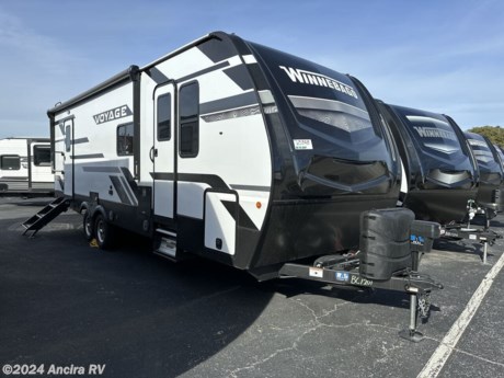 &lt;p&gt;&lt;strong&gt;Discover the 2023 Winnebago Voyage V2831RB: A Travel Trailer for Ultimate Comfort and Adventure&lt;/strong&gt;&lt;/p&gt;
&lt;p&gt;Embark on your next journey with the 2023 Winnebago Voyage V2831RB, designed for enthusiasts who seek adventure without compromising on comfort. This travel trailer is available at our dealership, located at &lt;a target=&quot;_new&quot;&gt;30500 Interstate 10 W, Boerne, TX 78006-9250&lt;/a&gt;, ready to be your home on the road.&lt;/p&gt;
&lt;p&gt;&lt;strong&gt;Key Specifications &amp;amp; Features:&lt;/strong&gt;&lt;/p&gt;
&lt;ul&gt;
&lt;li&gt;&lt;strong&gt;Spacious and Comfortable:&lt;/strong&gt; With a length of 31.67 feet, a width of 96 inches, and an interior height of 84 inches, the Voyage V2831RB provides ample space for living and storage??.&lt;/li&gt;
&lt;li&gt;&lt;strong&gt;Weight Details:&lt;/strong&gt; It has a dry weight of 7,460 lbs and a hitch weight of 840 lbs, making it essential to match it with an appropriately capable towing vehicle??.&lt;/li&gt;
&lt;li&gt;&lt;strong&gt;Capacity for Extended Adventures:&lt;/strong&gt; The model is equipped with a 60-gallon fresh water tank, 98 gallons of gray water capacity across two tanks, and a 49-gallon black water tank, supporting long stays off the grid??.&lt;/li&gt;
&lt;li&gt;&lt;strong&gt;Sleeping Accommodations:&lt;/strong&gt; Designed to comfortably sleep up to 6 people, it&#39;s perfect for families or groups seeking adventure??.&lt;/li&gt;
&lt;/ul&gt;
&lt;p&gt;&lt;strong&gt;Noteworthy Features:&lt;/strong&gt;&lt;/p&gt;
&lt;ul&gt;
&lt;li&gt;&lt;strong&gt;Durable and Stylish Construction:&lt;/strong&gt; Featuring an aluminum body with fiberglass sidewalls, along with two entry/exit doors for added convenience??.&lt;/li&gt;
&lt;li&gt;&lt;strong&gt;Outdoor Living Enhanced:&lt;/strong&gt; An 18 ft power retractable awning, exterior shower, and standard pass-thru storage make outdoor activities and storage more accessible??.&lt;/li&gt;
&lt;li&gt;&lt;strong&gt;Interior Amenities:&lt;/strong&gt; The interior boasts a kitchen and living area with bench seats, a full-size refrigerator, standard microwave, and a three-burner stove for all your culinary needs. The vinyl flooring and standard sofa add to the comfort and ease of maintenance??.&lt;/li&gt;
&lt;li&gt;&lt;strong&gt;Technology and Safety:&lt;/strong&gt; Equipped with a battery power converter, prewiring for air conditioning, cable, and satellite, ensuring comfort and connectivity. Safety features include smoke detectors, carbon monoxide detectors, and standard emergency exits??.&lt;/li&gt;
&lt;/ul&gt;
&lt;p&gt;For those interested in the 2023 Winnebago Voyage V2831RB, exploring financing options or evaluating your trade-in could be your next steps. &lt;a href=&quot;https://chat.openai.com/g/g-uPmS987Kd-ancira-rv-assistant/c/c8cf1a64-f70e-4e3b-85c8-d5640a45aff9&quot; target=&quot;_new&quot;&gt;Click here to apply for credit&lt;/a&gt; or &lt;a href=&quot;https://chat.openai.com/g/g-uPmS987Kd-ancira-rv-assistant/c/c8cf1a64-f70e-4e3b-85c8-d5640a45aff9&quot; target=&quot;_new&quot;&gt;evaluate your trade-in value&lt;/a&gt; seamlessly.&lt;/p&gt;
&lt;p&gt;To learn more about this travel trailer or to arrange a viewing, contact us directly at &lt;a target=&quot;_new&quot;&gt;(830) 981-9000&lt;/a&gt;. Let the Winnebago Voyage V2831RB be the gateway to your next great adventure, offering both the thrill of exploration and the comfort of home.&lt;/p&gt;