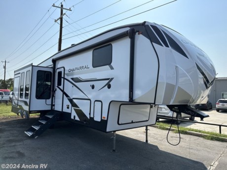 &lt;p&gt;&lt;span style=&quot;font-size: 14pt;&quot;&gt;This lightest fifth wheel in the Chaparral line-up will provide hassle-free towing and camping. You will find&amp;nbsp;&lt;strong&gt;dual opposing slides&lt;/strong&gt;&amp;nbsp;in the main living area for tons of space to stretch out, plus a&amp;nbsp;&lt;strong&gt;kitchen island&lt;/strong&gt;&amp;nbsp;that will make this area feel more like home. There is&amp;nbsp;&lt;strong&gt;theatre seating&lt;/strong&gt;&amp;nbsp;across from the entertainment center, and you can choose to add the optional 55&quot; LED TV for movies. The fully-equipped kitchen includes a stainless steel 30&quot; residential microwave, a 21&quot; oven with a residential cooktop, and a&lt;strong&gt;&amp;nbsp;second pantry&lt;/strong&gt;&amp;nbsp;for added storage space. And don&#39;t overlook the front private bedroom with a queen bed, a dresser, plus a large wardrobe with washer and dryer prep!&lt;/span&gt;&lt;/p&gt;
&lt;p&gt;&amp;nbsp;&lt;/p&gt;
&lt;p&gt;&lt;span style=&quot;font-size: 14pt;&quot;&gt;Each Chaparral mid-profile fifth wheel by Coachmen is designed with residential features, loads of storage space, and roomy bedroom suites to make you feel right at home. The durable construction means you can enjoy your RV for years to come. There&#39;s dual-sided&amp;nbsp;&lt;strong&gt;Azdel composite sidewall panels&lt;/strong&gt;, Weather Shield+ technology, and Tri-Tex powder coated frame technology that will allow you to camp year around. Each model includes a&amp;nbsp;&lt;strong&gt;Winegard Air 360&lt;/strong&gt;&amp;nbsp;HDTV/radio dome antenna and an AM/FM/CD/DVD player with Bluetooth to keep your entertained, plus&amp;nbsp;&lt;strong&gt;roller night shades&lt;/strong&gt;&amp;nbsp;and a modern electric fireplace to make your space cozy. There is also a large transom window in the kitchen, a modern high-rise faucet, LED motion sensor lights in the bathroom, plus a&lt;strong&gt;&amp;nbsp;full-size shower&lt;/strong&gt; with glass doors and a seat. Now that&#39;s what I call luxury! Choose a Chaparral fifth wheel today!&lt;/span&gt;&lt;/p&gt;