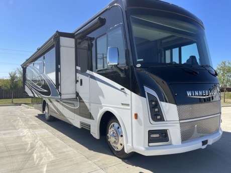 &lt;p&gt;The 2024 Winnebago Vista 34R is a spacious and luxurious Class A motorhome designed to deliver a premium RV experience. Measuring approximately 35 feet in length, this model is perfect for those who desire a blend of comfort, style, and functionality on their adventures. The exterior of the Vista 34R boasts a sleek and modern design that not only looks impressive but is also built to withstand the rigors of travel and varying weather conditions.&lt;/p&gt;
&lt;p&gt;Stepping inside the Vista 34R, you&#39;ll be welcomed by a thoughtfully designed living space. The main living area is configured with multiple slide-outs, creating an open and inviting interior. The living room is equipped with comfortable seating, a large LED TV, and an electric fireplace, providing a cozy ambiance for relaxation and entertainment. The fully equipped kitchen features high-quality appliances, solid surface countertops, and a residential refrigerator, making it easy to prepare meals while on the road. The master bedroom is a tranquil retreat with a comfortable queen-size bed, generous storage, and an en-suite bathroom for convenience and privacy.&lt;/p&gt;
&lt;p&gt;The 2024 Winnebago Vista 34R is also designed for outdoor enjoyment, featuring an electric awning with LED lighting for outdoor gatherings and relaxation. The motorhome is equipped with modern amenities like a powerful climate control system, a comprehensive entertainment system, and a well-designed bathroom with a spacious shower. Additional features include automatic leveling, ample fresh water storage, and a functional floor plan, ensuring that the Vista 34R offers a top-tier RV experience for travelers who seek a combination of comfort and convenience while exploring the open road.&lt;/p&gt;