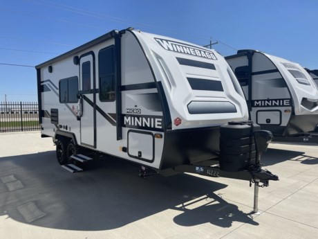 &lt;p&gt;Winnebago Industries Towables Micro Minnie travel trailer 2108FBS highlights:&lt;/p&gt;
&lt;ul&gt;
&lt;li&gt;Front RV Queen Bed&lt;/li&gt;
&lt;li&gt;Bathroom Wardrobe&lt;/li&gt;
&lt;li&gt;Three Burner Cooktop&lt;/li&gt;
&lt;li&gt;Patio Speakers&lt;/li&gt;
&lt;li&gt;USB Charging Ports&lt;/li&gt;
&lt;/ul&gt;
&lt;p&gt;&amp;nbsp;&lt;/p&gt;
&lt;p&gt;Pack your bags and head to the campground with this travel trailer! You will love all that it has to offer from the&amp;nbsp;full rear bathroom&amp;nbsp;with a skylight above the shower and a wardrobe for your linens to the front RV 60&quot; x 74&quot; queen bed with a&amp;nbsp;wardrobe&amp;nbsp;on one side, a nightstand on the other, and a privacy curtain to draw at night. The 44&quot; x 72&quot;&amp;nbsp;booth dinette slide&amp;nbsp;is not only a great place to enjoy your meals at or play card games, but also to transform into an extra sleeping space if you want to bring along a guest or two. When you don&#39;t feel like making dinner, you can easily pop in some leftovers or a bag of popcorn into the&amp;nbsp;microwave&amp;nbsp;and relax while you watch a movie on the LED TV!&lt;/p&gt;
&lt;p&gt;&amp;nbsp;&lt;/p&gt;
&lt;p&gt;Start out on your boundless journey in one of these Winnebago Industries Towables Micro Minnie travel trailers! Towing is made simple with the 7&#39; width to keep your Micro Minnie in your rear-view mirror and can turn at a snap. They don&#39;t lack in features although they are compact in size. The spacious galley with the sink, the double door refrigerator, the cooktop, and even a microwave allows you to cook without compromise. You will not only enjoy entertainment indoors with the LED TV, the AV system, the WiFi prep, and the wireless cell phone charger, but also outdoors with the patio speakers and the power awning with LED lighting. Each model comes with flexible exterior storage to make packing quick and easy. The extreme weather foil wrapping, the NXG engineered chassis, and the TPO roof ensures you will have years of fun with one of these!&lt;/p&gt;