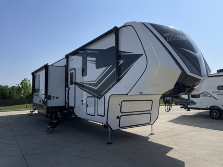 &lt;p&gt;Grand Design Momentum M-Class 414M toy hauler fifth wheel highlights:&lt;/p&gt;
&lt;ul&gt;
&lt;li&gt;Queen Bed Slide Out&lt;/li&gt;
&lt;li&gt;U-Shaped Kitchen Counter&lt;/li&gt;
&lt;li&gt;Theater Seating&lt;/li&gt;
&lt;li&gt;Kitchen Pantry&lt;/li&gt;
&lt;li&gt;14&#39; Separate Garage&lt;/li&gt;
&lt;li&gt;Flip-Up Pet Dish&lt;/li&gt;
&lt;/ul&gt;
&lt;p&gt;Any time spent in this spacious toy hauler will be time well spent! The 14&#39; garage includes an overhead loft bed and a flip-up pet dish for your furry friends. If you&#39;re needing more sleeping space, you might want to choose the optional Happi-Jac rollover sofas&amp;nbsp;and table with a drop down bed and&amp;nbsp;optional half bath! Once you enter in the main living area, you can relax on the tri-fold sofa or theater seating across from the fireplace, and there is a free-standing dinette if you want to play a game or two. The chef of your group will love the generous counter space in the kitchen, and the&amp;nbsp;dual entry bath&amp;nbsp;will let everyone stay clean throughout your trip! Head to the front master bedroom to enjoy the queen bed slide out with an optional king bed, a&amp;nbsp;slide top dresser with TV prep, plus a large front closet, complete with washer and dryer prep!&lt;/p&gt;
&lt;p&gt;With any Momentum M-Class toy hauler by Grand Design, you will enjoy luxury at every turn! They have been constructed to a superior standard with a thermal roof design, triple insulated main floor and garage floor, and a Rail-Tite underbelly seal that will allow you to camp in all elements. Each model also features a, 8&#39; 5&quot; wide body chassis with a wide rail design, no wheel wheels, and a dovetail entry for easier loading. The Stealth A/C system provides maximum cooling power, and the CRE3000 suspension system means you can enjoy a smooth tow each time. You will love the luxurious interior with a professional grade stainless steel cooktop, interior color changing LED accent lighting, a fiberglass shower with a glass door, and solid surface countertops.&lt;/p&gt;