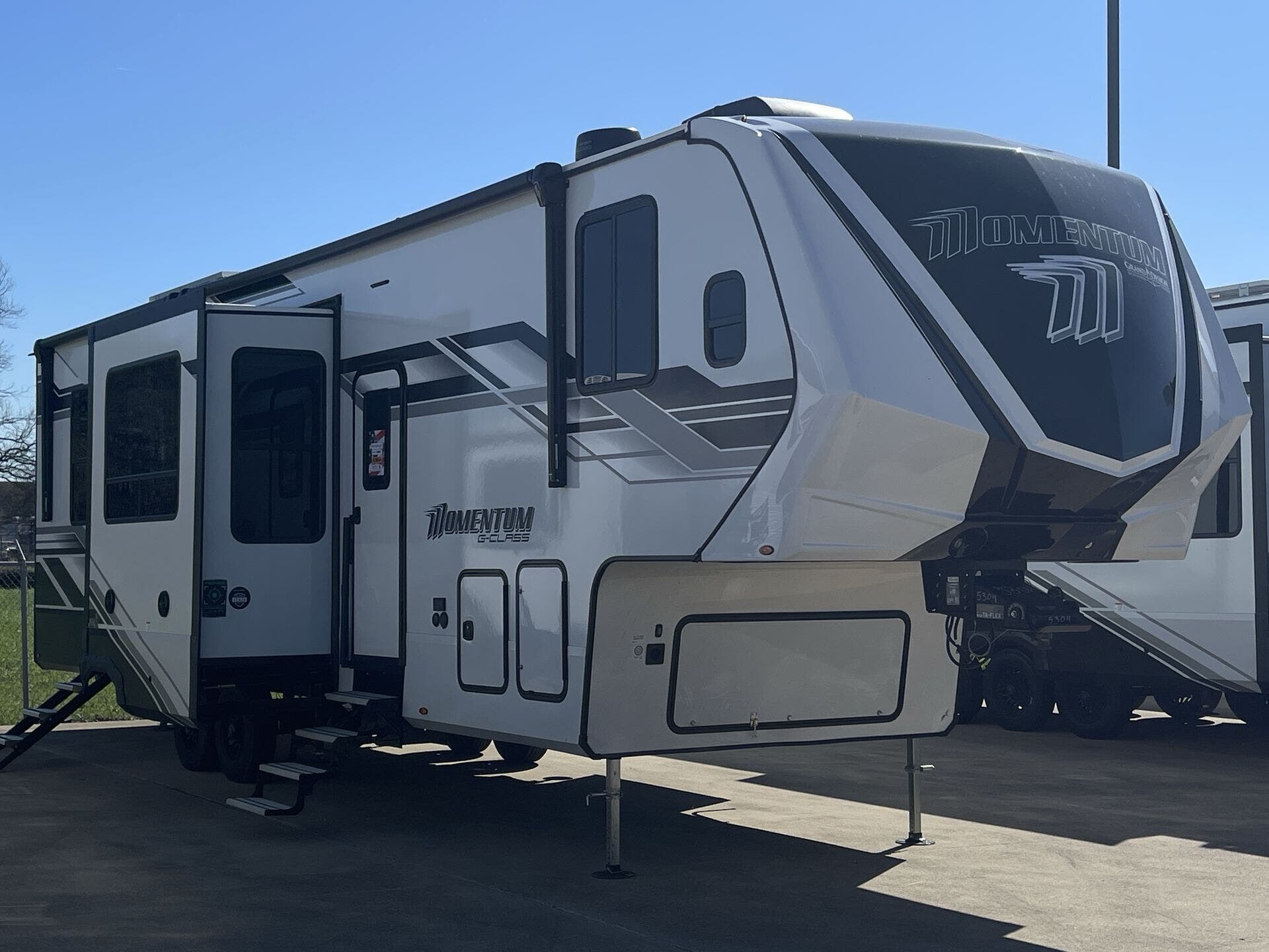 2026 Grand Design Momentum G-Class 350G - New Fifth Wheel For Sale by McClain's RV Fort Worth in Fort Worth, Texas features Furnace, TV, Converter, Smart TV, Ladder