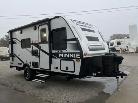 &lt;p class=&quot;MsoNormal&quot;&gt;&lt;span style=&quot;font-size: 12.0pt; line-height: 107%; font-family: &#39;Arial&#39;,sans-serif;&quot;&gt;The Winnebago Micro Minnie 1700BH is a super lightweight travel trailer that is built for the road! &lt;/span&gt;&lt;/p&gt;
&lt;p class=&quot;MsoNormal&quot;&gt;&lt;span style=&quot;font-size: 12.0pt; line-height: 107%; font-family: &#39;Arial&#39;,sans-serif;&quot;&gt;This little bunkhouse camper has 4-corner stabilizer jacks, exterior speakers, alloy wheels, an electric tongue jack, and a power patio awning. In the rear, you have two bunks next to an enclosed bathroom with a toilet and shower. &lt;/span&gt;&lt;/p&gt;
&lt;p class=&quot;MsoNormal&quot;&gt;&lt;span style=&quot;font-size: 12.0pt; line-height: 107%; font-family: &#39;Arial&#39;,sans-serif;&quot;&gt;There is a full kitchenette on one wall that has a sink, stove, convection microwave, and a refrigerator. &lt;/span&gt;&lt;span style=&quot;font-size: 12.0pt; line-height: 107%; font-family: &#39;Arial&#39;,sans-serif;&quot;&gt;Across from the kitchen is a dinette booth that converts into an extra bed. &lt;/span&gt;&lt;/p&gt;
&lt;p class=&quot;MsoNormal&quot;&gt;&lt;span style=&quot;font-size: 12.0pt; line-height: 107%; font-family: &#39;Arial&#39;,sans-serif;&quot;&gt;Finally, there is a full-size bed in the front with storage above and below. The Micro Minnie has a dry weight of about 3,000 pounds, so you can tow it with almost anything. Call, email, or just come by and check it out!&lt;/span&gt;&lt;/p&gt;