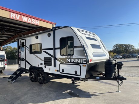 &lt;p style=&quot;box-sizing: border-box; margin-top: 0px; margin-bottom: 1rem; color: #373a3c; font-family: Nunito, sans-serif; font-size: 16px;&quot;&gt;Introducing the 2024 Winnebago Micro Minnie 1821FBS, a compact and versatile travel trailer that redefines the art of on-the-go living. This lightweight wonder is designed for adventurers who seek the perfect balance between functionality and comfort. With its thoughtful layout and modern amenities, the Micro Minnie 1821FBS offers a delightful travel experience for couples or small families.&lt;/p&gt;
&lt;p style=&quot;box-sizing: border-box; margin-top: 0px; margin-bottom: 1rem; color: #373a3c; font-family: Nunito, sans-serif; font-size: 16px;&quot;&gt;Measuring at just the right size, the 1821FBS combines nimble towing with a surprisingly spacious interior. The exterior showcases Winnebago&#39;s commitment to durability and aerodynamic design, making it easy to maneuver on the open road. Its sleek profile is complemented by stylish graphics and premium finishes, ensuring that you travel in both style and substance.&lt;/p&gt;
&lt;p style=&quot;box-sizing: border-box; margin-top: 0px; margin-bottom: 1rem; color: #373a3c; font-family: Nunito, sans-serif; font-size: 16px;&quot;&gt;Step inside, and you&#39;ll be greeted by a smartly designed living space that maximizes every inch. The open floor plan seamlessly integrates the kitchen, dining, and living areas, creating a welcoming atmosphere for socializing or relaxation. The kitchen is equipped with modern appliances, ample storage, and a functional workspace, allowing you to prepare delicious meals on the go.&lt;/p&gt;
&lt;p style=&quot;box-sizing: border-box; margin-top: 0px; margin-bottom: 1rem; color: #373a3c; font-family: Nunito, sans-serif; font-size: 16px;&quot;&gt;The cozy sleeping quarters feature a comfortable bed and clever storage solutions, making the most of the available space. The bathroom is both efficient and stylish, featuring a shower, toilet, and vanity with all the comforts of home. Large windows throughout the trailer provide natural light and panoramic views, connecting you with the beauty of your surroundings.&lt;/p&gt;
&lt;p style=&quot;box-sizing: border-box; margin-top: 0px; margin-bottom: 1rem; color: #373a3c; font-family: Nunito, sans-serif; font-size: 16px;&quot;&gt;The 1821FBS is equipped with cutting-edge technology to enhance your travel experience. From entertainment systems to climate control, Winnebago has integrated the latest features to keep you connected and comfortable. The trailer&#39;s energy-efficient design and eco-friendly components contribute to a sustainable and responsible travel lifestyle.&lt;/p&gt;
&lt;p style=&quot;box-sizing: border-box; margin-top: 0px; margin-bottom: 1rem; color: #373a3c; font-family: Nunito, sans-serif; font-size: 16px;&quot;&gt;Whether you&#39;re embarking on a weekend getaway or an extended road trip, the 2024 Winnebago Micro Minnie 1821FBS is your ticket to adventure. Compact, stylish, and brimming with thoughtful features, this travel trailer is poised to be the ideal companion for those who crave the freedom of the open road without compromising on the comforts of home.&lt;/p&gt;