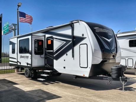 &lt;p class=&quot;MsoNormal&quot;&gt;&lt;span style=&quot;font-size: 16px; line-height: 107%; font-family: Arial, sans-serif;&quot;&gt;Grand Design has combined all of the best things about a travel trailer and combined them with the functionality of a toy hauler to create one incredible RV! The Momentum 31G is jam-packed with amazing features like pass thru storage, tinted windows, exterior security lights, and a power patio awning with integrated LED lighting.&lt;/span&gt;&lt;/p&gt;
&lt;p class=&quot;MsoNormal&quot;&gt;&lt;span style=&quot;font-size: 16px; line-height: 107%; font-family: Arial, sans-serif;&quot;&gt;Inside, the Momentum 31G is full of luxurious amenities such as recessed LED ceiling lighting, blue LED accent lighting, the Slate d&amp;eacute;cor, and beautiful raised panel hardwood cabinet doors with hidden hinges. Cooking lunch or dinner will be a breeze in this exquisite kitchen. The sink covers, 3-burner stove top with oven below, and microwave will ensure you have all the tools you need! But perhaps the best part of this kitchen is the refrigerator and storage space!&lt;/span&gt;&lt;/p&gt;
&lt;p class=&quot;MsoNormal&quot;&gt;&lt;span style=&quot;font-size: 16px; line-height: 107%; font-family: Arial, sans-serif;&quot;&gt;Across from the kitchen, you&amp;rsquo;ll find a large theater style sofa! What an amazing feature and a relaxing place to put up your feet at the end of the day?! Need a place to sit for dinner? This model also comes with a removable table that can be set up to create a nice place to gather the family for dinner!&lt;/span&gt;&lt;/p&gt;
&lt;p class=&quot;MsoNormal&quot;&gt;&lt;span style=&quot;font-size: 16px; line-height: 107%; font-family: Arial, sans-serif;&quot;&gt;The garage is located at the back of the trailer and provides plenty of space to not only bring along your favorite toys but also to accommodate more friends and family with the Happi-Jac electric bunk system with fold and tumble sofas. This particular model also comes with a rear garage ramp door and Rockford Fosgate Speakers!!&lt;/span&gt;&lt;/p&gt;
&lt;p class=&quot;MsoNormal&quot;&gt;&lt;span style=&quot;font-size: 16px; line-height: 107%; font-family: Arial, sans-serif;&quot;&gt;This trailer features a bath and a half! The half bath is located in the garage, while the full bathroom is attached to the master bedroom. The half bath comes with a sink and foot flush toilet. The full bathroom comes with a foot flush toilet, sink with storage underneath and a shower with a retractable door.&lt;/span&gt;&lt;/p&gt;
&lt;p class=&quot;MsoNormal&quot;&gt;&lt;span style=&quot;font-size: 16px; line-height: 107%; font-family: Arial, sans-serif;&quot;&gt;The exquisite bedroom is located at the front as well and ensures you will rest easy in a queen-sized bed with a beautiful bedspread. But that&amp;rsquo;s not all! You&amp;rsquo;ll also appreciate the generous amount of storage in the mirrored dresser next to the bed.&lt;/span&gt;&lt;/p&gt;
&lt;p class=&quot;MsoNormal&quot;&gt;&lt;span style=&quot;font-size: 16px; line-height: 107%; font-family: Arial, sans-serif;&quot;&gt;The Grand Design Momentum 31G brings together style and fun! This beautiful travel trailer can only fully be appreciated by stopping in to check out all of the unbelievable features!&lt;/span&gt;&lt;/p&gt;