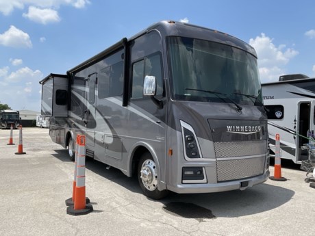 &lt;p&gt;&lt;strong&gt;HAIL DISCOUNT APPLIED&lt;/strong&gt;&lt;/p&gt;
&lt;p&gt;The 2023 Winnebago Vista 33K is a spacious and well-appointed Class A motorhome that offers a luxurious and comfortable traveling experience. With its thoughtful design, modern amenities, and attention to detail, the Vista 33K is designed to provide you with a home away from home as you embark on your RV adventures.&lt;/p&gt;
&lt;p&gt;The Vista 33K features a well-organized and roomy interior layout. The living area is designed for relaxation and entertainment, featuring comfortable seating options such as a sofa and a dinette. Large windows and an open floor plan create a bright and inviting atmosphere, allowing you to enjoy the scenic views along your journey.&lt;/p&gt;
&lt;p&gt;The fully equipped kitchen is a highlight of the Vista 33K, offering high-quality appliances such as a stove, microwave, refrigerator, sink, and ample storage cabinets. The kitchen is designed to cater to your culinary needs, making it convenient for preparing meals during your travels. It includes solid surface countertops and a pantry for added convenience.&lt;/p&gt;
&lt;p&gt;The motorhome&#39;s sleeping arrangements are designed for comfort and adaptability. The private master bedroom includes a comfortable queen-sized bed with premium bedding and storage options. Additionally, the convertible sofa and dinette can provide additional sleeping space for family and guests.&lt;/p&gt;
&lt;p&gt;The bathroom is designed for convenience and style, featuring a spacious shower, toilet, sink, and vanity. This private space allows you to freshen up and unwind in comfort after a day of travel or outdoor activities.&lt;/p&gt;
&lt;p&gt;The Vista 33K is equipped with modern amenities to enhance your RV experience, including air conditioning, heating systems, entertainment options, and advanced technology features. These amenities ensure that you can enjoy a comfortable and enjoyable lifestyle while on the road.&lt;/p&gt;
&lt;p&gt;The exterior of the Vista 33K showcases Winnebago&#39;s commitment to quality and craftsmanship, with sleek lines, durable construction, and appealing paint finishes. Exterior amenities include an awning, storage compartments, and outdoor entertainment options, allowing you to fully embrace outdoor living.&lt;/p&gt;
&lt;p&gt;&amp;nbsp;&lt;/p&gt;
&lt;p&gt;&lt;span style=&quot;color: rgb(236, 240, 241);&quot;&gt;aprilok&lt;/span&gt;&lt;/p&gt;