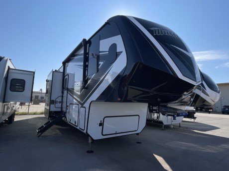 &lt;div&gt;Grand Design Momentum fifth wheel toy hauler 399TH highlights:&lt;/div&gt;
&lt;div&gt;
&lt;ul&gt;
&lt;li&gt;Fold-Down Side Patio&lt;/li&gt;
&lt;li&gt;13&#39; Garage&lt;/li&gt;
&lt;li&gt;Bath and a Half&lt;/li&gt;
&lt;li&gt;Dual Entry&lt;/li&gt;
&lt;li&gt;Island with Bar Stools&lt;/li&gt;
&lt;li&gt;60 Gallon Fuel Tank&lt;/li&gt;
&lt;/ul&gt;
&lt;p&gt;&amp;nbsp;&lt;/p&gt;
&lt;p&gt;Get ready for a lot of fun when you head out to the off-road park, a special event, or a long trip with your toys! You will love the garage with the&amp;nbsp;Fast Ramp rear ramp door, the&amp;nbsp;Ram-Air garage vents&amp;nbsp;on both sides, the 2,500 lb. rated flush-mount tie-downs and the protective diamond plate on the garage sidewalls. This area can become a bedroom or an extra living area if you want to add Happi-Jac rollover sofas/table with a&amp;nbsp;top bed option, plus you will already have a half bath for convenience, an LED TV and storage for your gear. The living and kitchen area is spacious with dual slides and a kitchen island with bar stools, a free standing table and&amp;nbsp;theatre seating&amp;nbsp;or choose the super sofa option, and everything you need to feed everyone. The&amp;nbsp;fold-down side patio&amp;nbsp;offers an LED TV, storage and a great place to relax outdoors above ground. There are many more features to enjoy, and several options to customize your fifth wheel.&amp;nbsp;&lt;/p&gt;
&lt;p&gt;&amp;nbsp;&lt;/p&gt;
&lt;p&gt;The Momentum fifth wheel toy haulers by Grand Design are built for four seasons of travel with your off-road toys and include luxurious accommodations throughout for extreme living! Each is constructed to a superior standard with the thermal roof design, the full-laminated walls, and the triple insulated garage floor. The MORryde CRE3000 suspension system and rubber pin box, plus the upgraded axle hangers provide the performance and smooth towing you desire, while the interior offers luxury such as color changing LED accent lighting, raised panel hardwood cabinet doors with hidden hinges, and a central vacuum system. Each toy hauler also includes four packages, including the Garage Package with Tuff-Ply gas and oil resistant flooring, the Weather-Tek Package with a Stealth AC System, and the Interior Luxury Package with solid surface countertops!&lt;/p&gt;
&lt;/div&gt;