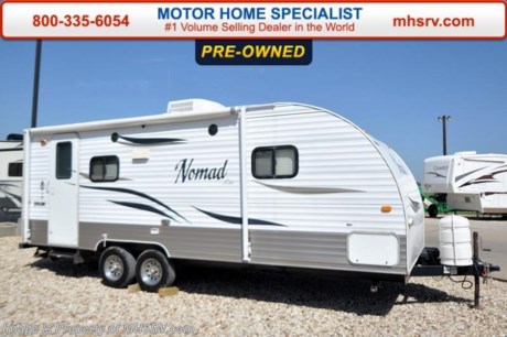 Used Skyline Travel Trailer- 2010 SkylineNomad Lite 224LT is approximately 21 feet 9 inches in length with a slide, patio awning, water heater, pass-thru storage, aluminum wheels, exterior shower, exterior speakers, sofa with sleeper, blinds, microwave, 3 burner range with oven, all in 1 bath, glass door shower, ducted A/C and much more. For additional information and photos please visit Motor Home Specialist at www.MHSRV .com or call 800-335-6054.