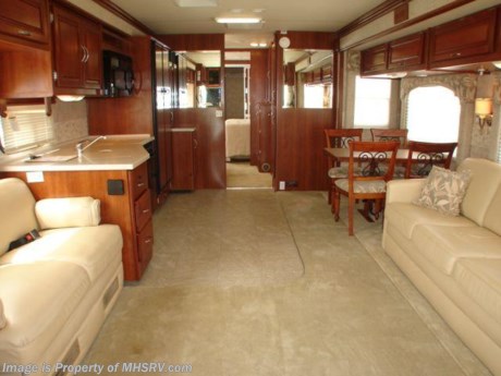 &lt;a href=&quot;http://www.mhsrv.com/other-rvs-for-sale/fleetwood-rvs/&quot;&gt;&lt;img src=&quot;http://www.mhsrv.com/images/sold-fleetwood.jpg&quot; width=&quot;383&quot; height=&quot;141&quot; border=&quot;0&quot; /&gt;&lt;/a&gt; 2006 Fleetwood Bounder 38&#39; W/ 4 Slides, model 38L. This RV comes equipped with a 300HP diesel engine on the Freightliner chassis, Onan 7.5K quiet diesel generator, hydraulic coach levelers, Xantrex 2000 watt inverter, dual ducted roof A/Cs, full-body exterior paint, Trac-Vision SF fully automatic satellite, power entry door &amp; patio awnings, full air ride suspension with ABS, air brakes, Energy Management System, brake retarder, tilt-telescopic wheel, power remote mirrors with defrost, power sun visors, leather pilot &amp; co-pilot seats with electric controls, power foot rest on passenger side, leather hide-a-bed sofa sleeper, dinette table &amp; chairs, dual pane insulated windows, day/night shades throughout, steel drawer glides, solid surface counter tops, four-door refrigerator with ice maker, convection microwave, high-output three burner range with oven, split bath with shower, private toilet, WASHER/DRYER COMBO, rear wardrobe closet, basement storage, 10K hitch receiver, roof ladder, solar panel, roof-mounted air horns, front bra cover, slide-out topper awnings, non-smoker, and much more. ONLY 8K MILES! 