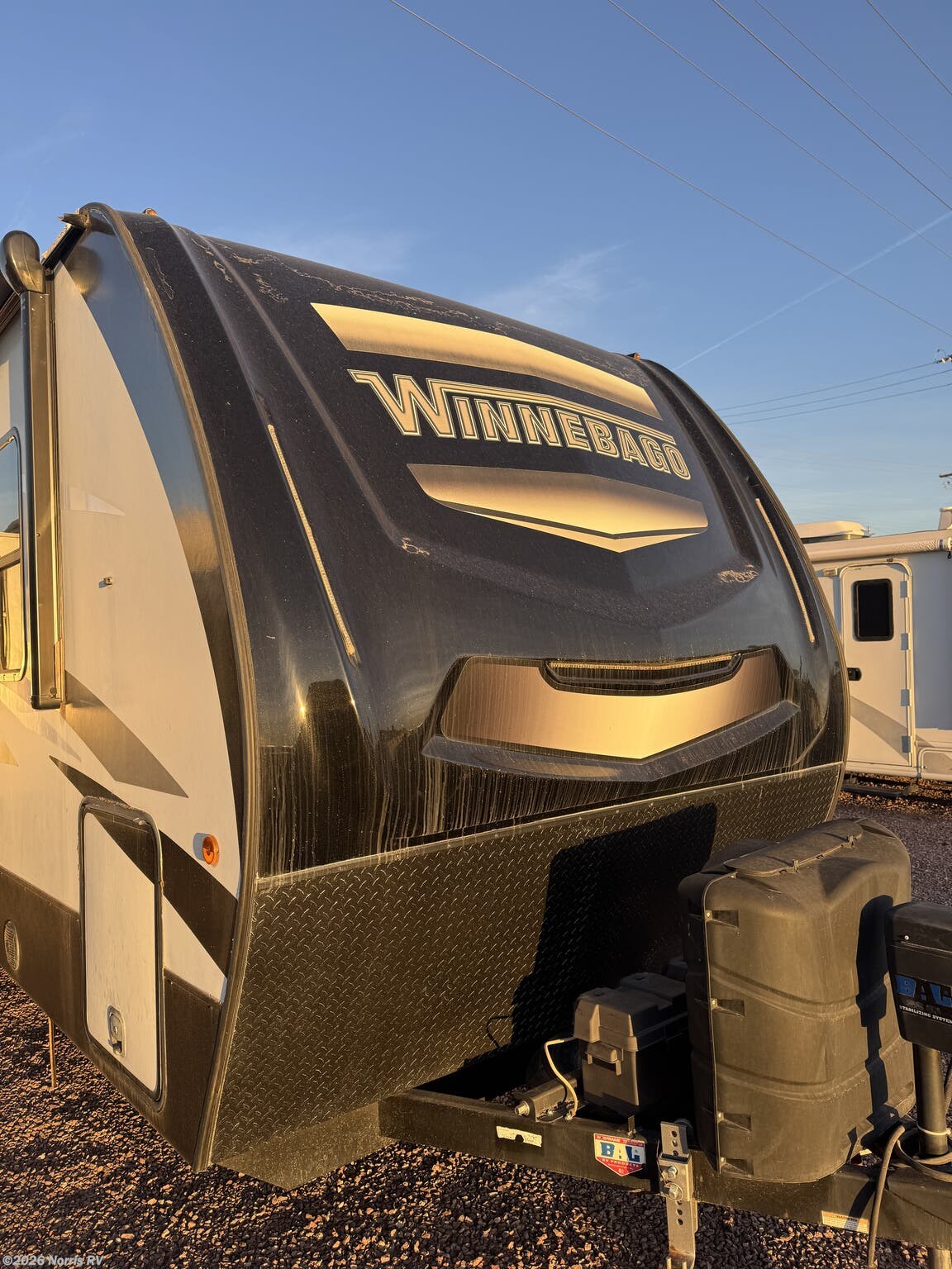 2021 Winnebago Voyage 3235RL - Used Travel Trailer For Sale by Norris RV in Casa Grande, Arizona features Microwave, TV, Thermofoil Countertops, Queen Bed, Stabilizer Jacks