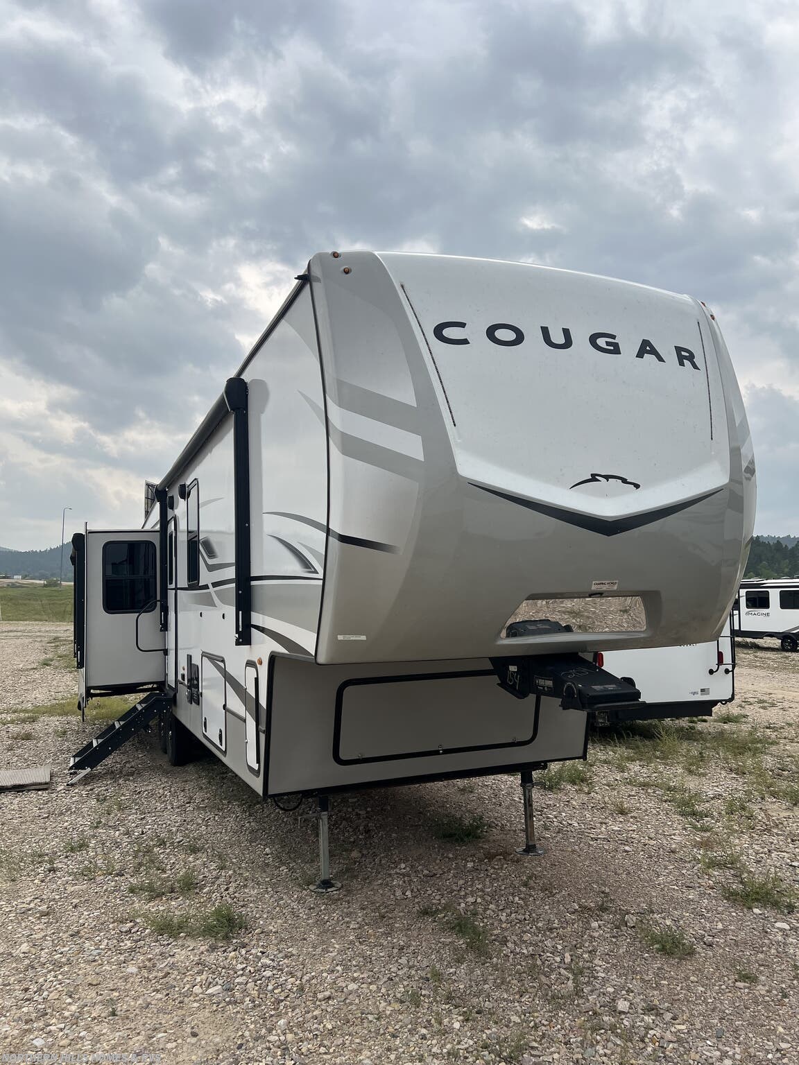 2023 Keystone Cougar East 355FBS - Used Fifth Wheel For Sale by Northern Hills Homes and RV's in Whitewood, South Dakota features Fireplace, Ladder, DVD Player, Skylight, Microwave