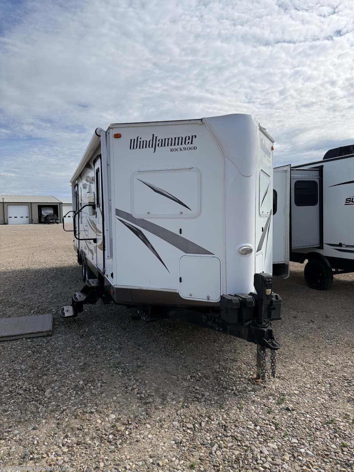 2015 Forest River Rockwood Windjammer 2809W - Used Travel Trailer For Sale by Northern Hills Homes and RV's in Whitewood, South Dakota features Stabilizer Jacks, Microwave, Stove, Smoke Detector, Furnace