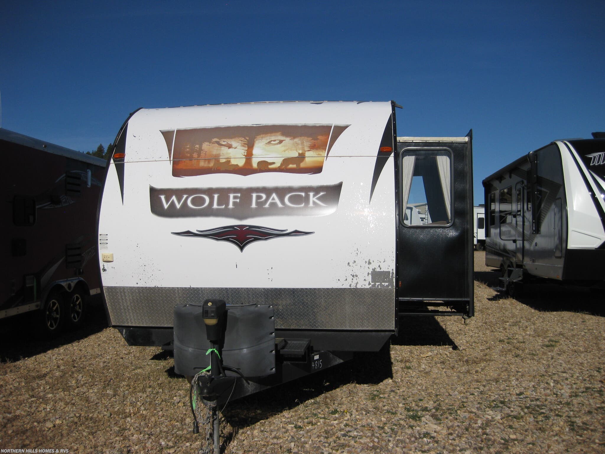 2013 Forest River Cherokee Wolf Pack 28WP - Used Toy Hauler For Sale by Northern Hills Homes and RV's in Whitewood, South Dakota features Water Heater, Kitchen Sink, Refrigerator, Microwave, Roof Deck