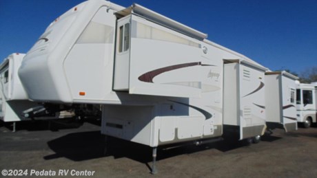 Here is a loaded quad slide fifth wheel. Even has a built in Onan generator! call 866-733-2829 for a complete list of options and to schedule a free live virtual tour! 