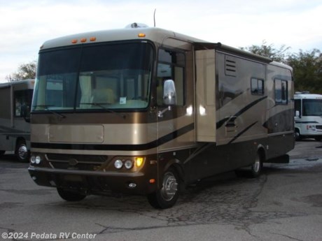 &lt;p&gt;&amp;nbsp;&lt;/p&gt;

&lt;p&gt;This 2005 Safari Trek is a beautiful and rare short class A with all the extras that you could want in a high quality class A.&amp;nbsp; Features include: leveling jacks, power inverter, power patio awning, satellite radio, TV, DVD, VCR, 5.1 surround sound, satellite dish, fantastic fan, three way back up camera, pantry, refrigerator with ice, convection microwave oven, solid surface counter tops, and ceramic tile floors.&lt;/p&gt;
