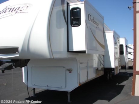 &lt;p&gt;This is an unbelievable price on a quad slide fifth wheel. If you&#39;re looking for room to stretch out this is the one for you. Loaded with extras like a 4 door refrigerator and a LCD TV that disappears into the counter! Call 866-733-2829 before it&#39;s too late.&lt;/p&gt;

&lt;p&gt;&amp;nbsp;&lt;/p&gt;
