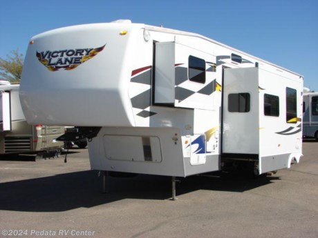 &lt;p&gt;This 2008 triple slide Victory Lane is everything you could want in a fifth wheel and everything that you could want in a toy hauler. Features include large HDTV, exterior stereo, fuel pump station, glass shower, duel bunk beds in garage with bench seat, sleeper sofa, ceiling fan, spacious kitchen with a breakfast bar and skylight. For complete information call us toll free at 888-545-8314.&lt;/p&gt;
