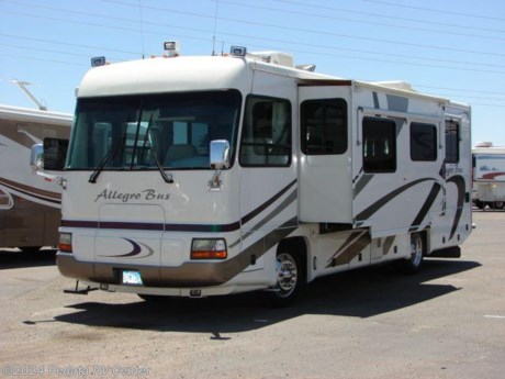 &lt;p&gt;This 2003 Tiffin Allegro Bus is a beautiful and desirable short little diesel pusher. Features include TV, DVD, VCR, satellite dish, 5.1 surround sound, spotlight, pass through storage, power inverter, solid surface counter top, convection microwave oven, icemaker, pantry, fantastic fan, ceramic tile floor, encased window awnings, and power patio awning. For complete information call us toll free at 888-545-8314.&lt;/p&gt;
