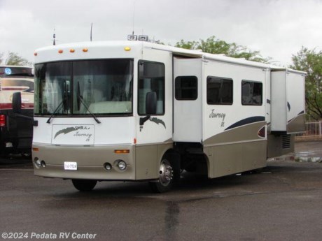 &lt;p&gt;This 2002 Winnebago Journey is a great way to get into a diesel pusher at a very affordable price. Features include TV, VCR, five-point surround sound, convection microwave oven, solid surface counter tops, two large pull out pantries, tile floor, built-in coffee maker, ice maker, built-in washer/dryer, fantastic fan, external shower, and an encased patio awning. For complete information call us toll free at 888-545-8314.&lt;/p&gt;
