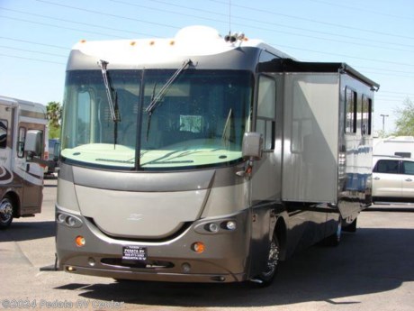 &lt;p&gt;This 2004 Coachmen Cross Country is great way to get into a diesel pusher with a lot of extras. Features include TV, DVD, satellite dish, 5.1 surround sound, CD, MP3, CB, power inverter, solid surface counter top, large refrigerator, convection microwave oven, thermal pane windows, day-night shades, and patio awning. For complete information call us toll free at 888-545-8314.&lt;/p&gt;
