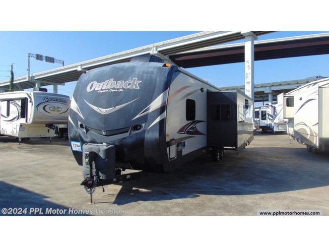 2015 Keystone Outback Super Lite 323BH - Used Travel Trailer For Sale by PPL Motor Homes in Houston, Texas features Bunk Beds, External Shower, TV, Spare Tire Kit, Stabilizer Jacks