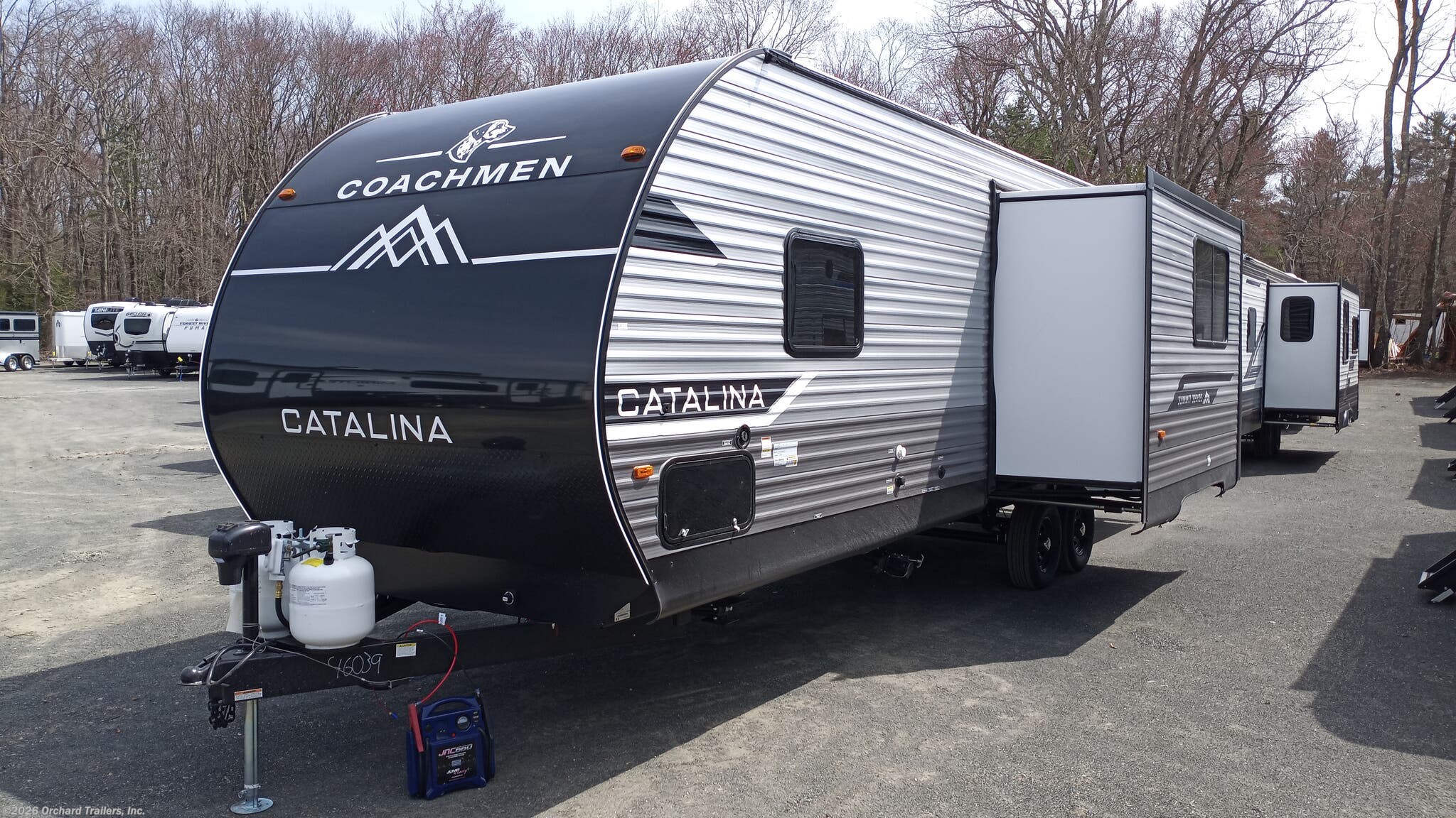 2025 Coachmen Catalina Summit Series 8 271DBS - New Travel Trailer For Sale by Orchard Trailers, Inc. in Whately, Massachusetts features Awning, Exterior Speakers, Water Heater, Spare Tire Kit, Outside Kitchen