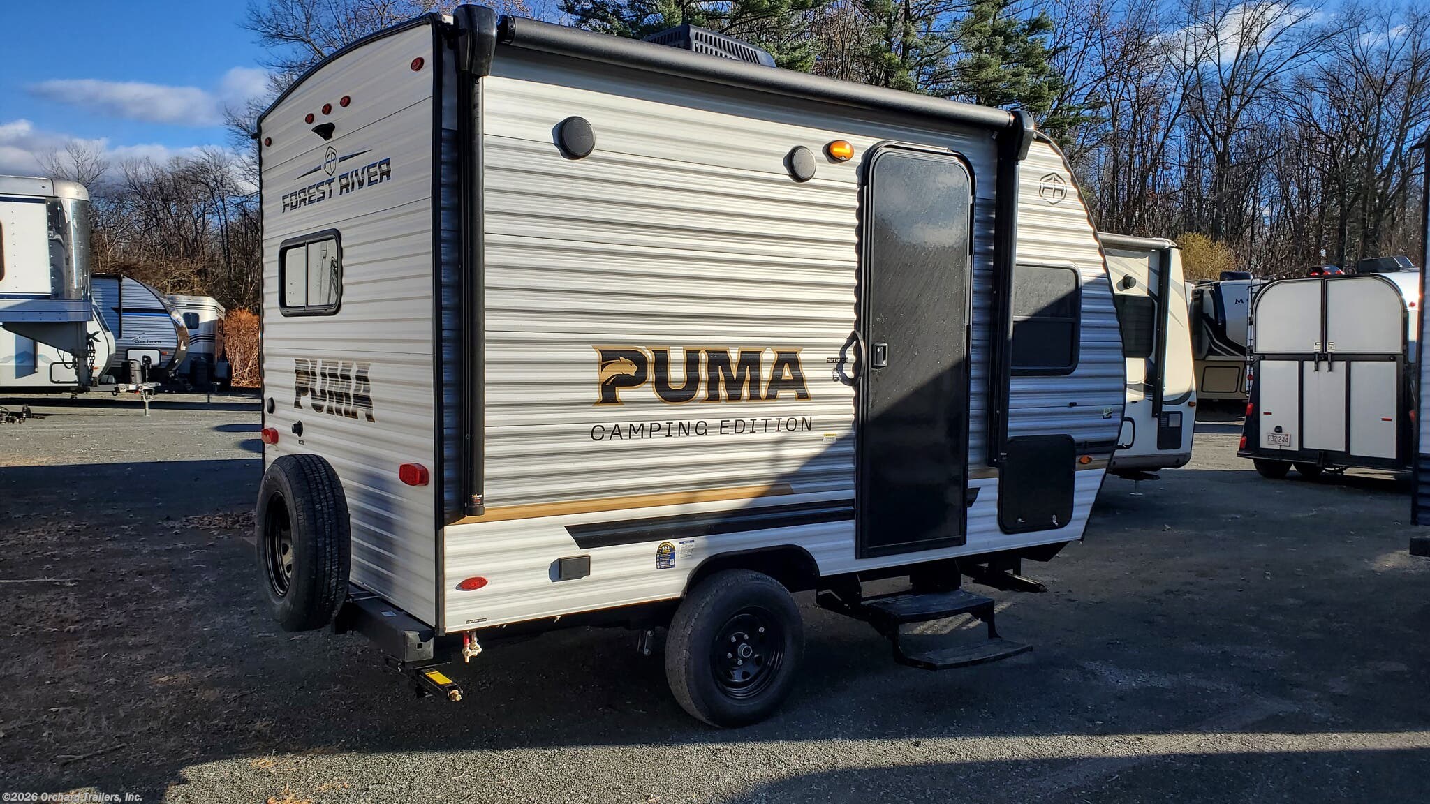 2026 Forest River Puma Camping Edition 121RKCE - New Travel Trailer For Sale by Orchard Trailers, Inc. in Whately, Massachusetts features Heat Pump, Thermofoil Countertops, Microwave, Water Heater, Pleated Shades