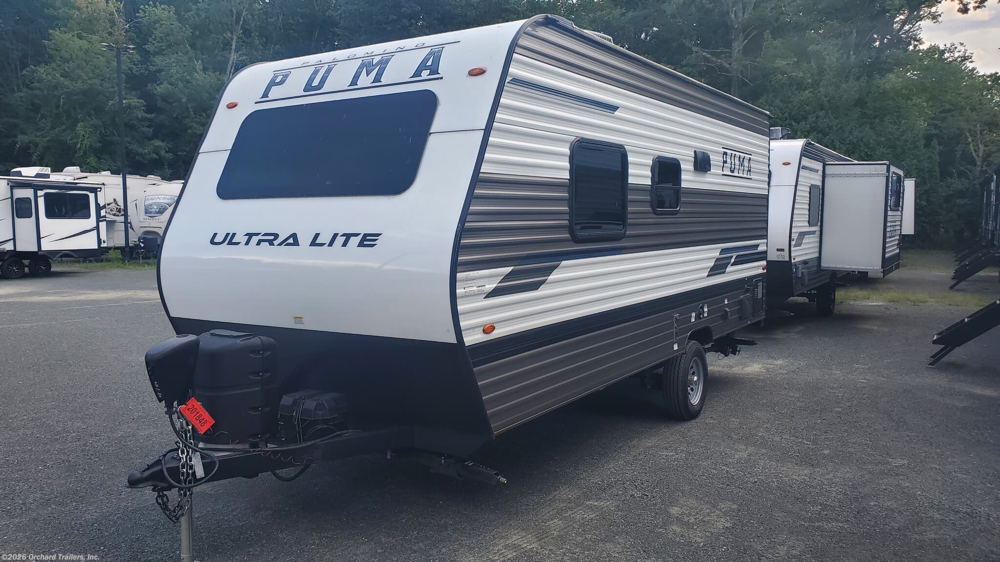 2023 Palomino Puma Ultra Lite 16QBX - Used Travel Trailer For Sale by Orchard Trailers, Inc. in Whately, Massachusetts features TV, Shower, Tinted Windows, Stabilizer Jacks, Skylight