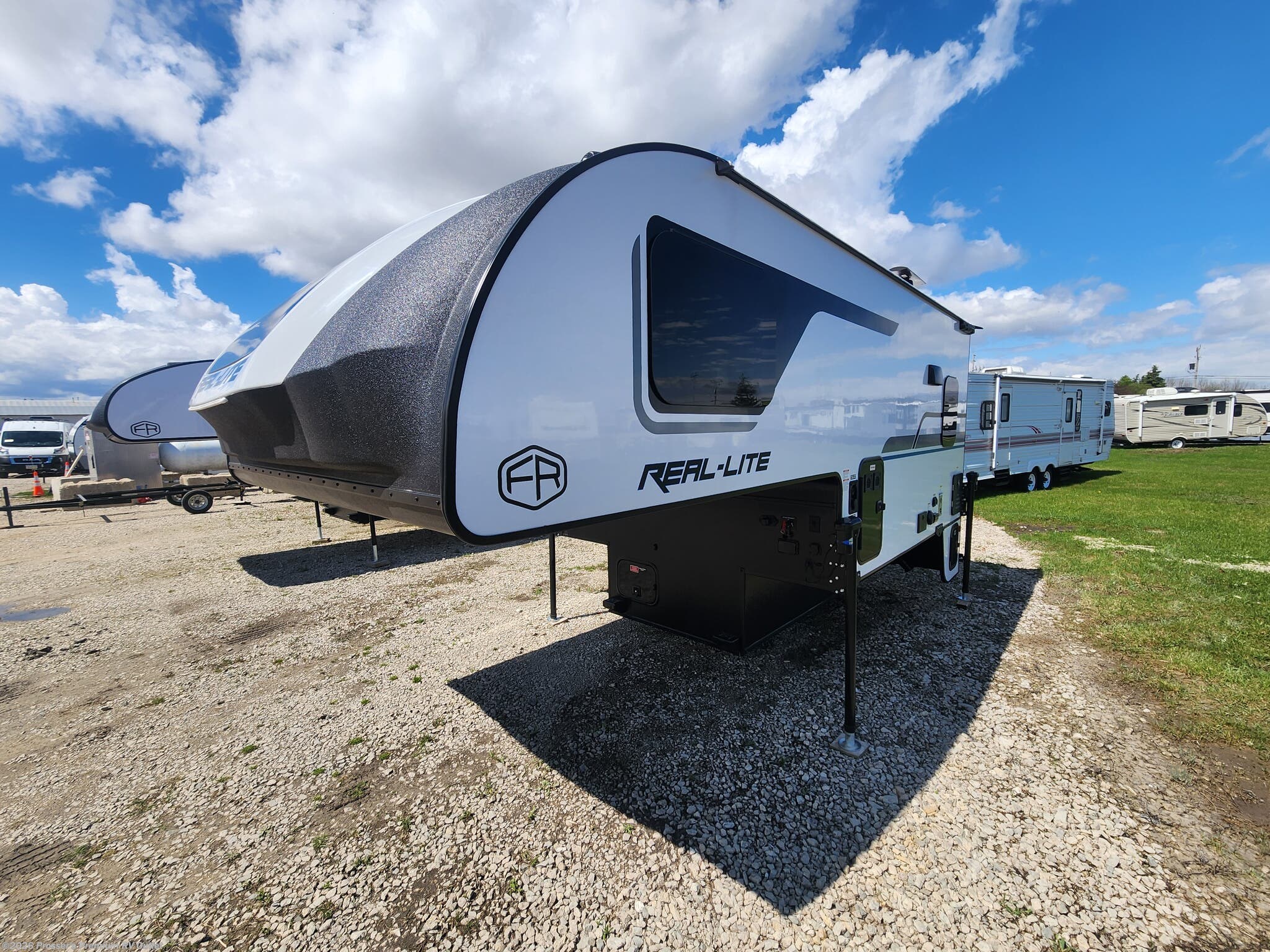 2026 Palomino Real-Lite HS-2114 - New Truck Camper For Sale by Prosser's Premium RV Outlet in Sturtevant, Wisconsin features Air Conditioning, Leveling Jacks, Solar Panels, Electric Jack, LP Detector