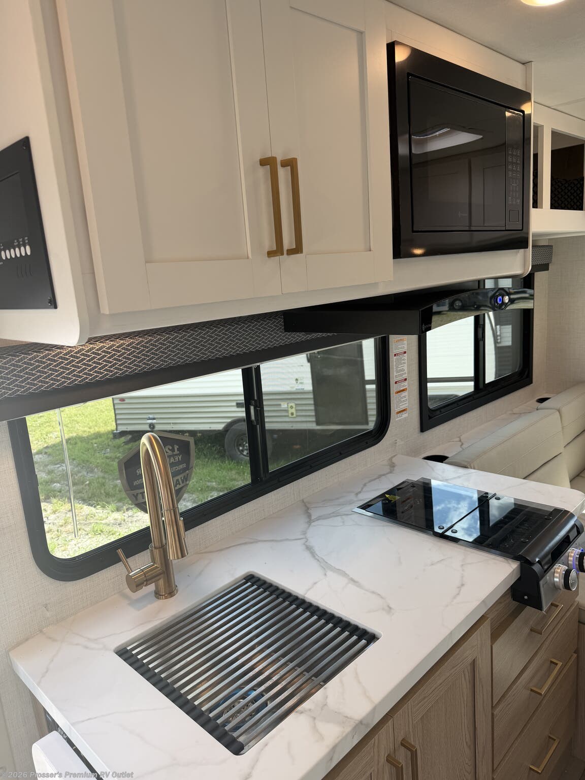 2027 Thor Motor Coach Four Winds 19Z - New Class C For Sale by Prosser's Premium RV Outlet in Sturtevant, Wisconsin features Refrigerator, Toilet, Water Heater, Black Tank Flush, Ladder