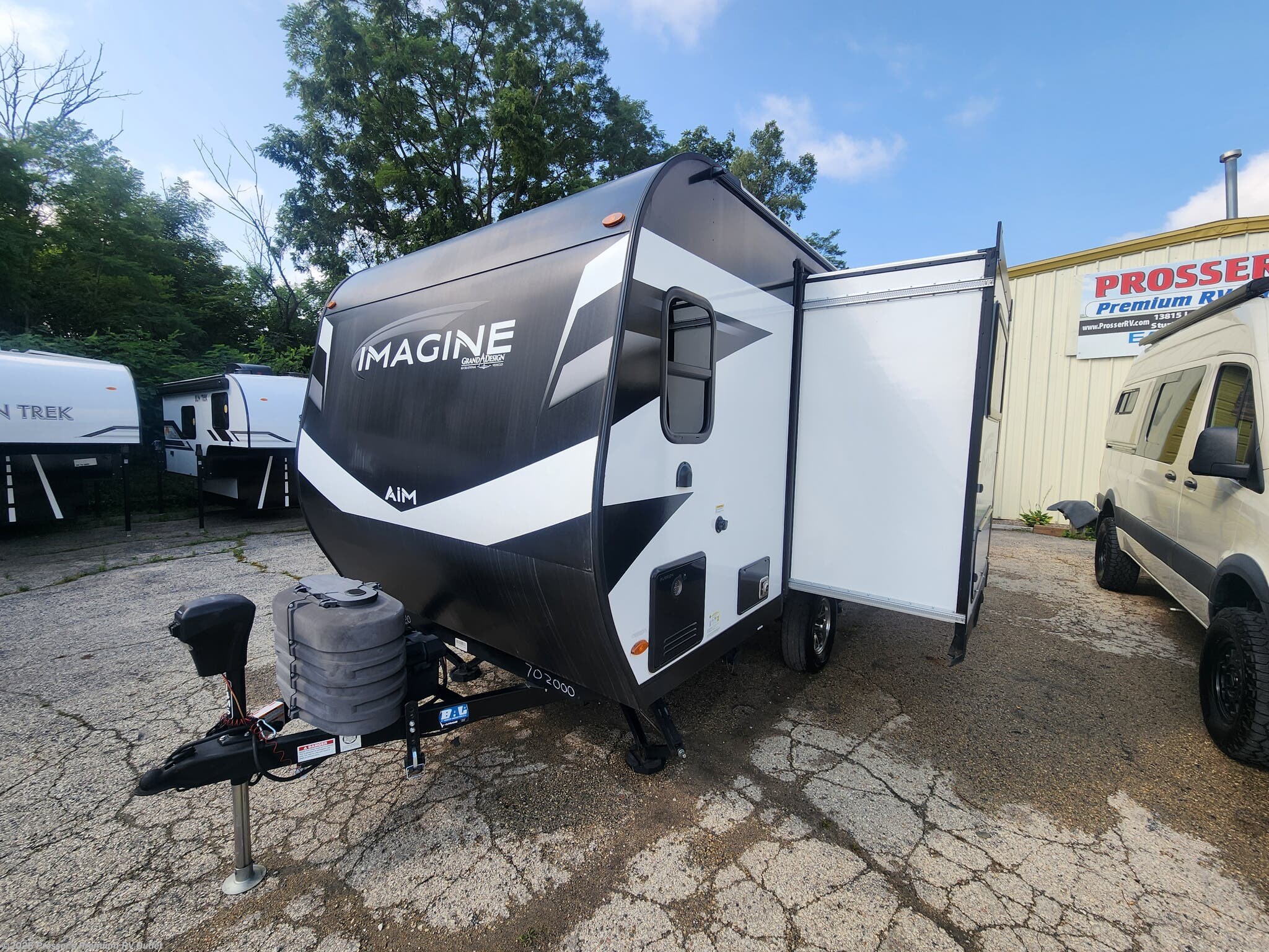 2024 Grand Design Imagine AIM 14MS - Used Travel Trailer For Sale by Prosser's Premium RV Outlet in Sturtevant, Wisconsin features Refrigerator, Ladder, Water Heater, Griddle, Solar Panel